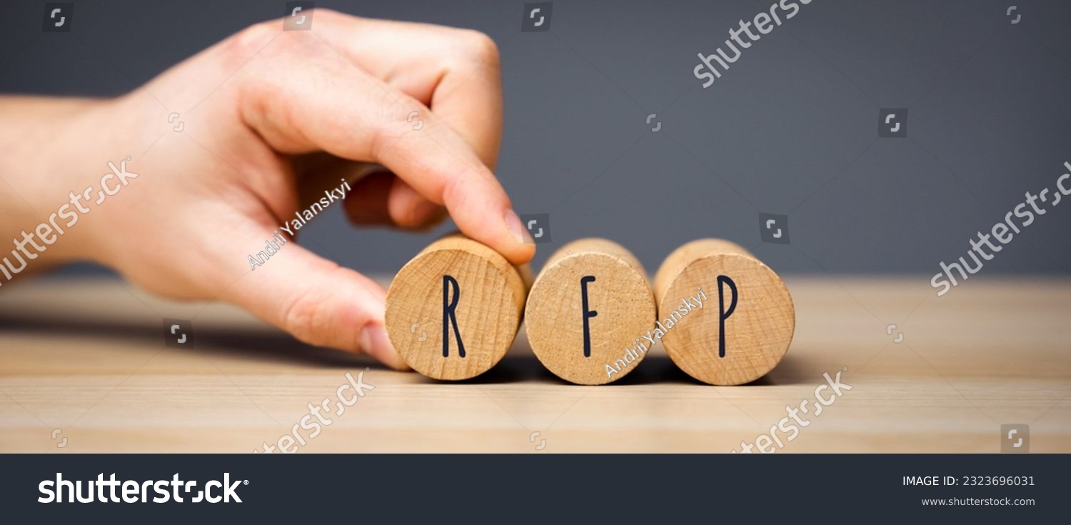 RFP wooden blocks - Request For Proposal. A documented request from an organization that is interested in acquiring goods or services. Business and finance concept #2323696031