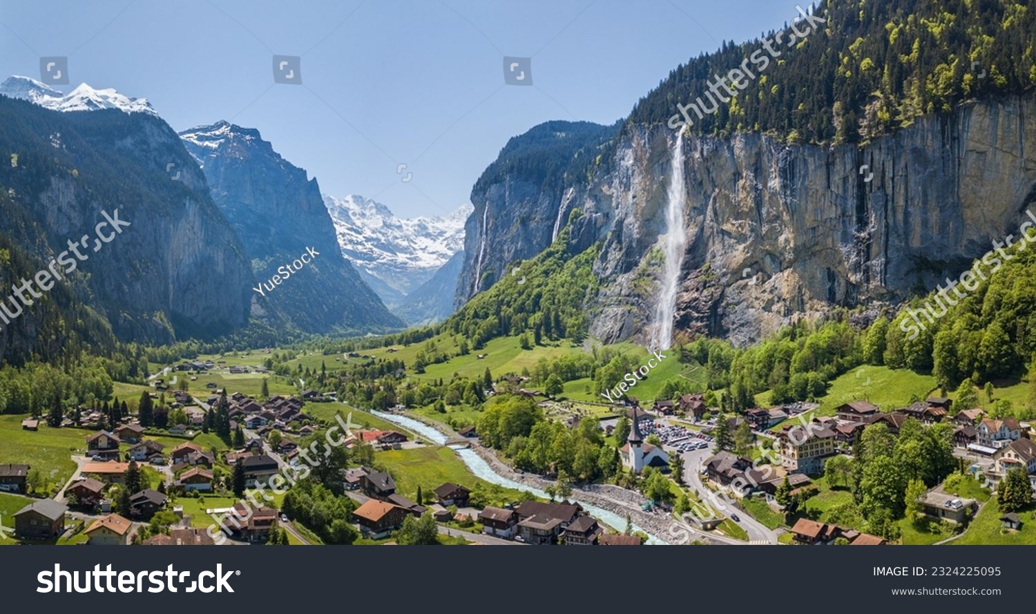 Aerial panorama image of the beautiful village Lauterbrunnen with Staubbach waterfall and snow mountain Jungfrau at the background #2324225095