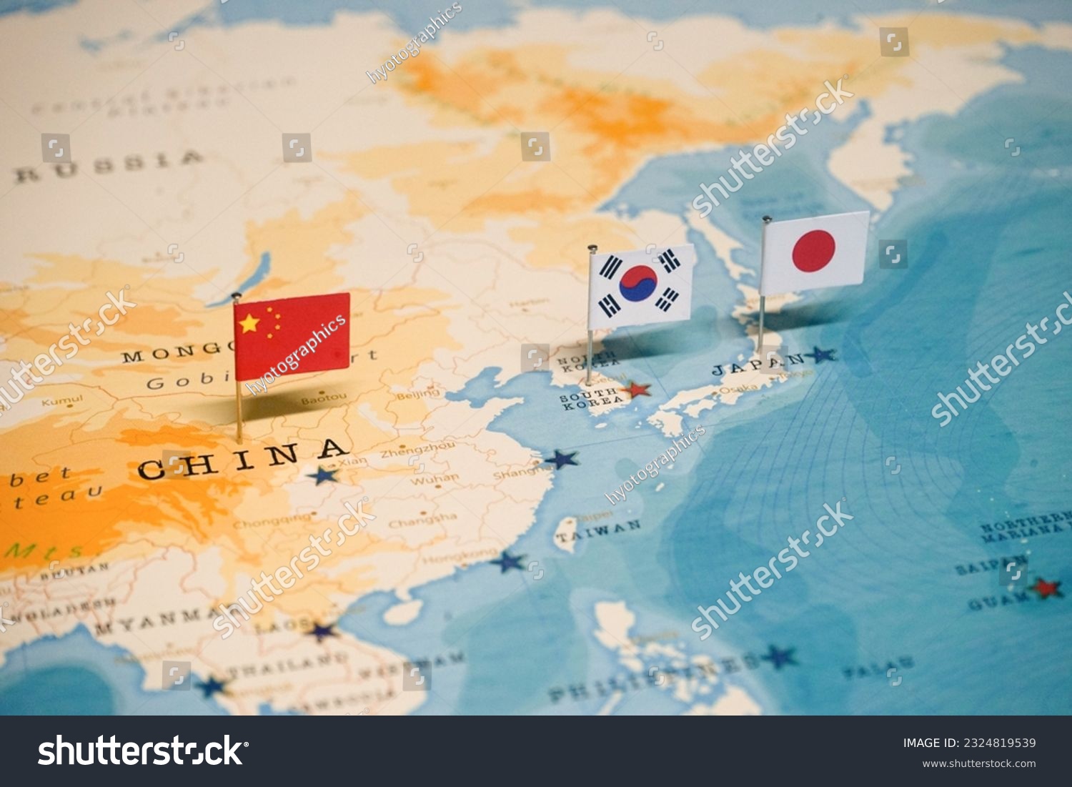 The Flag of Korea and China and Japan on the World Map. #2324819539