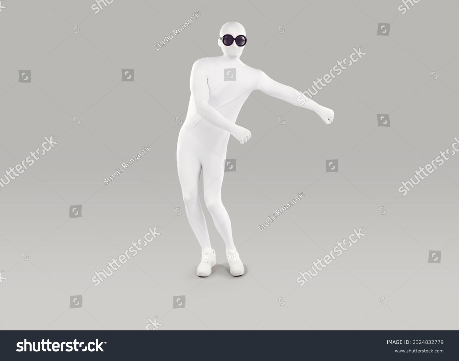 Funny man in bodysuit costume dancing in studio. Full length shot of man disguised in white spandex suit and black round sunglasses doing floss dance isolated on gray background #2324832779