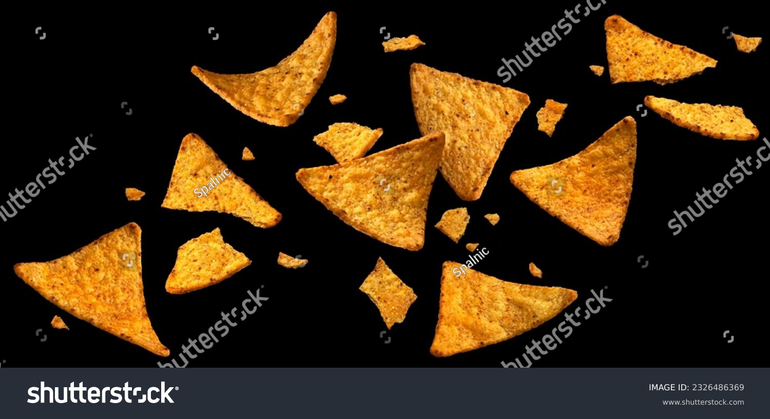 Falling corn chips, hot Mexican nachos isolated on black background #2326486369