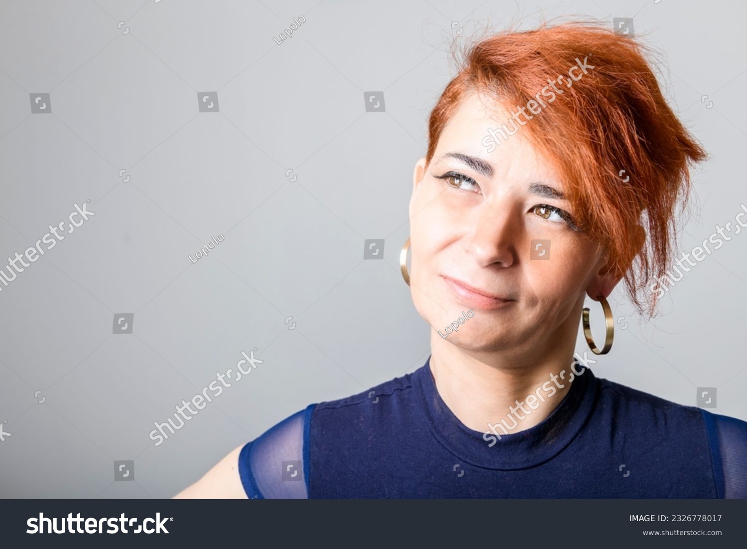 A Portrait of a mature woman on studio background #2326778017