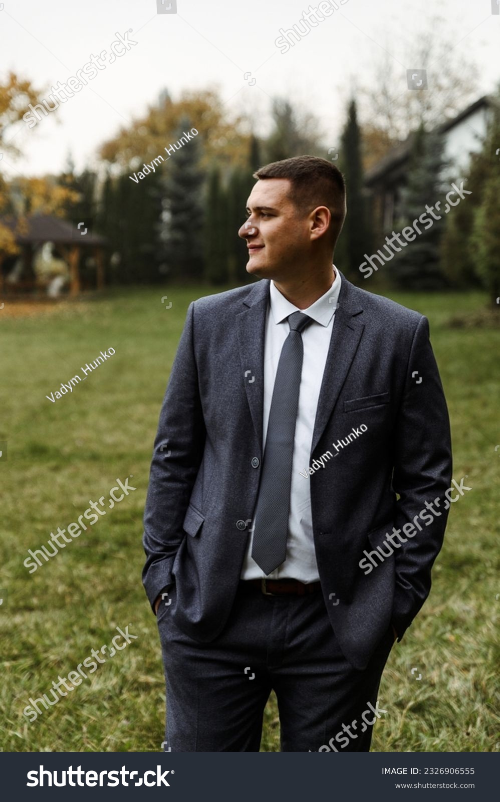 portrait of the groom outside in the autumn season.stylish tall groom in a blue suit.businessman in nature. portrait of a successful man #2326906555