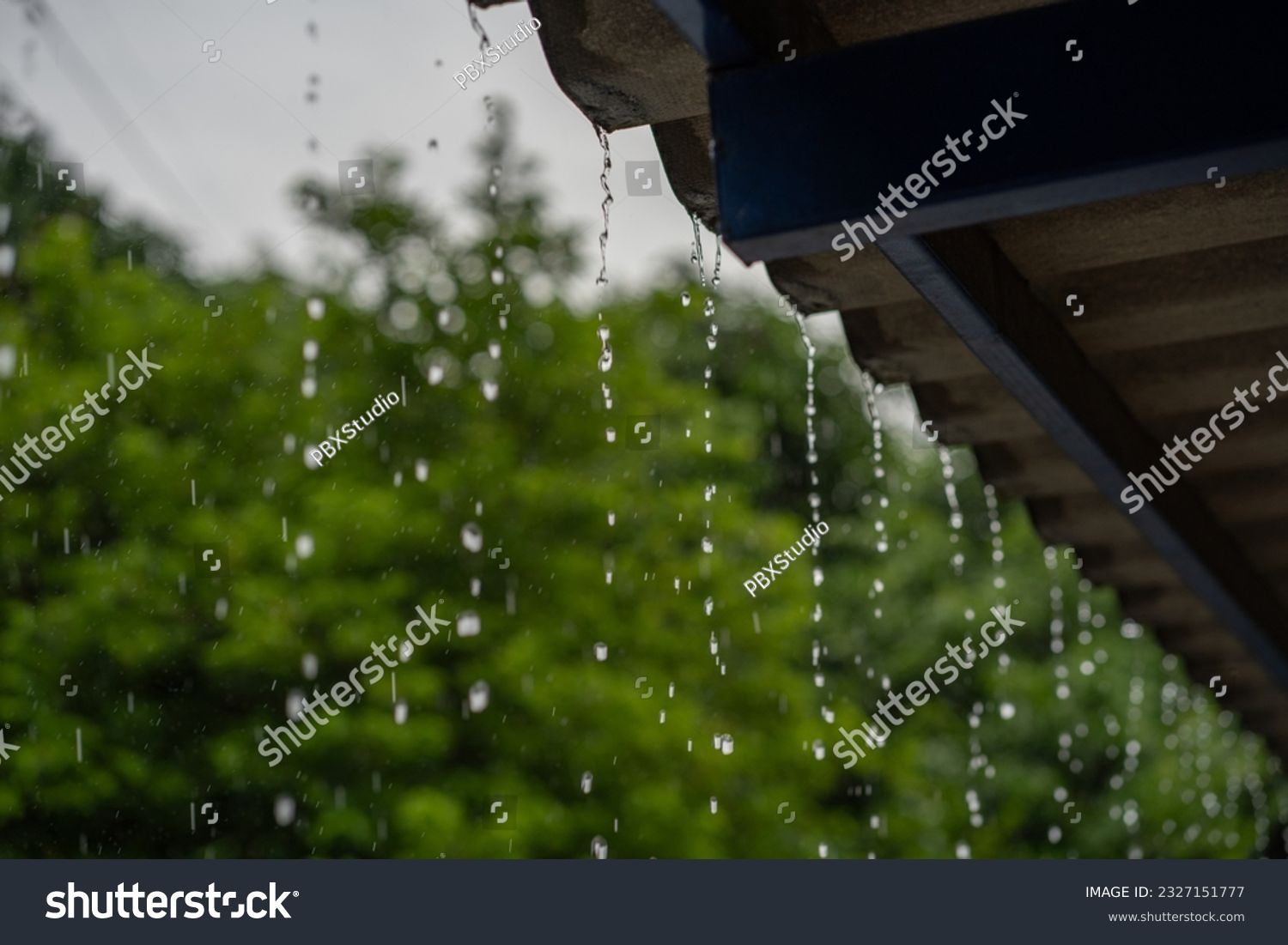Close-up of raindrops on the roof in the rainy season. #2327151777