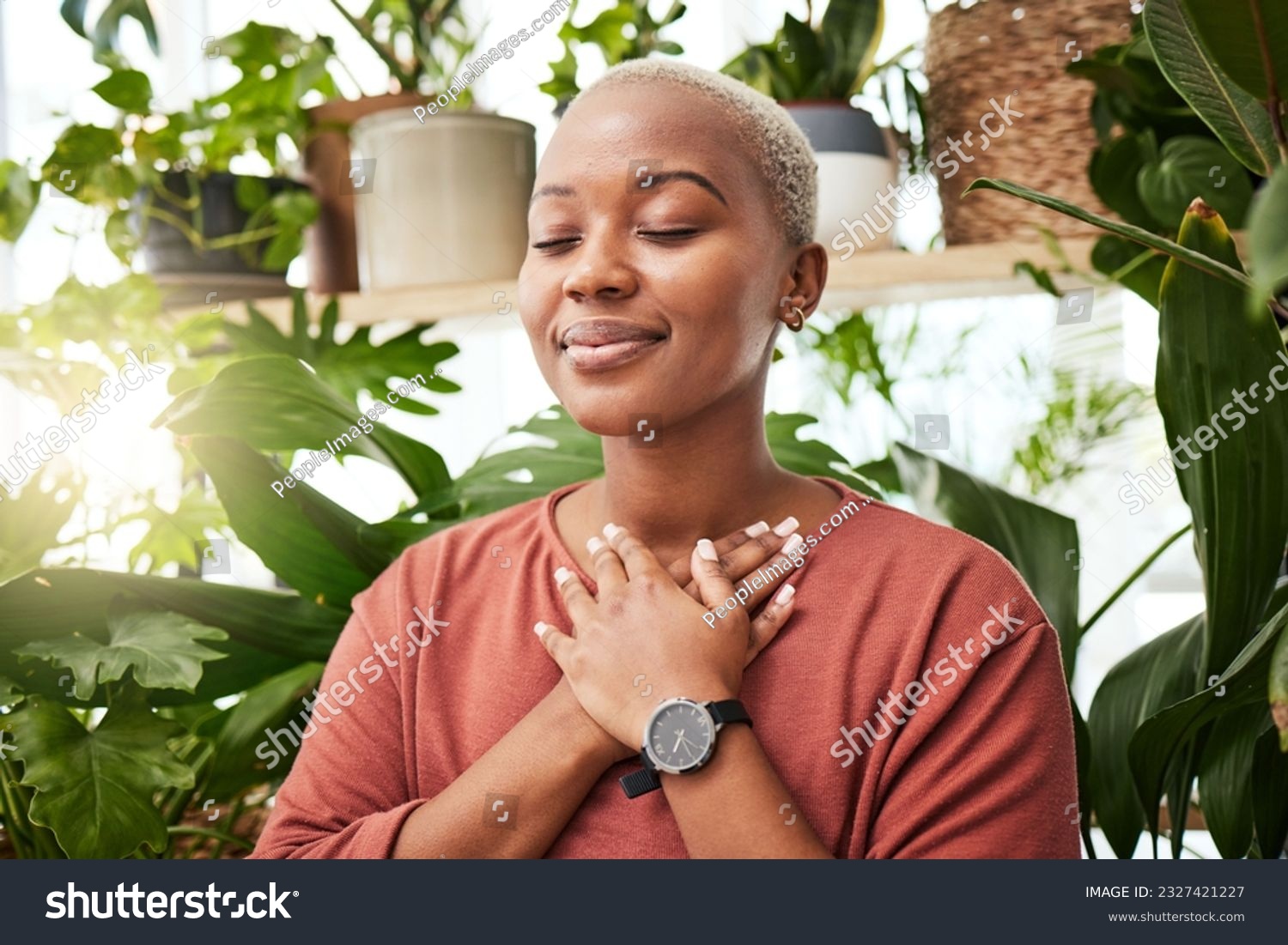 Balance, breathing and young woman by plants for zen meditation in a greenery nursery. Breathe, gratitude and young African female person with a relaxing peace mindset by an indoor greenhouse garden. #2327421227