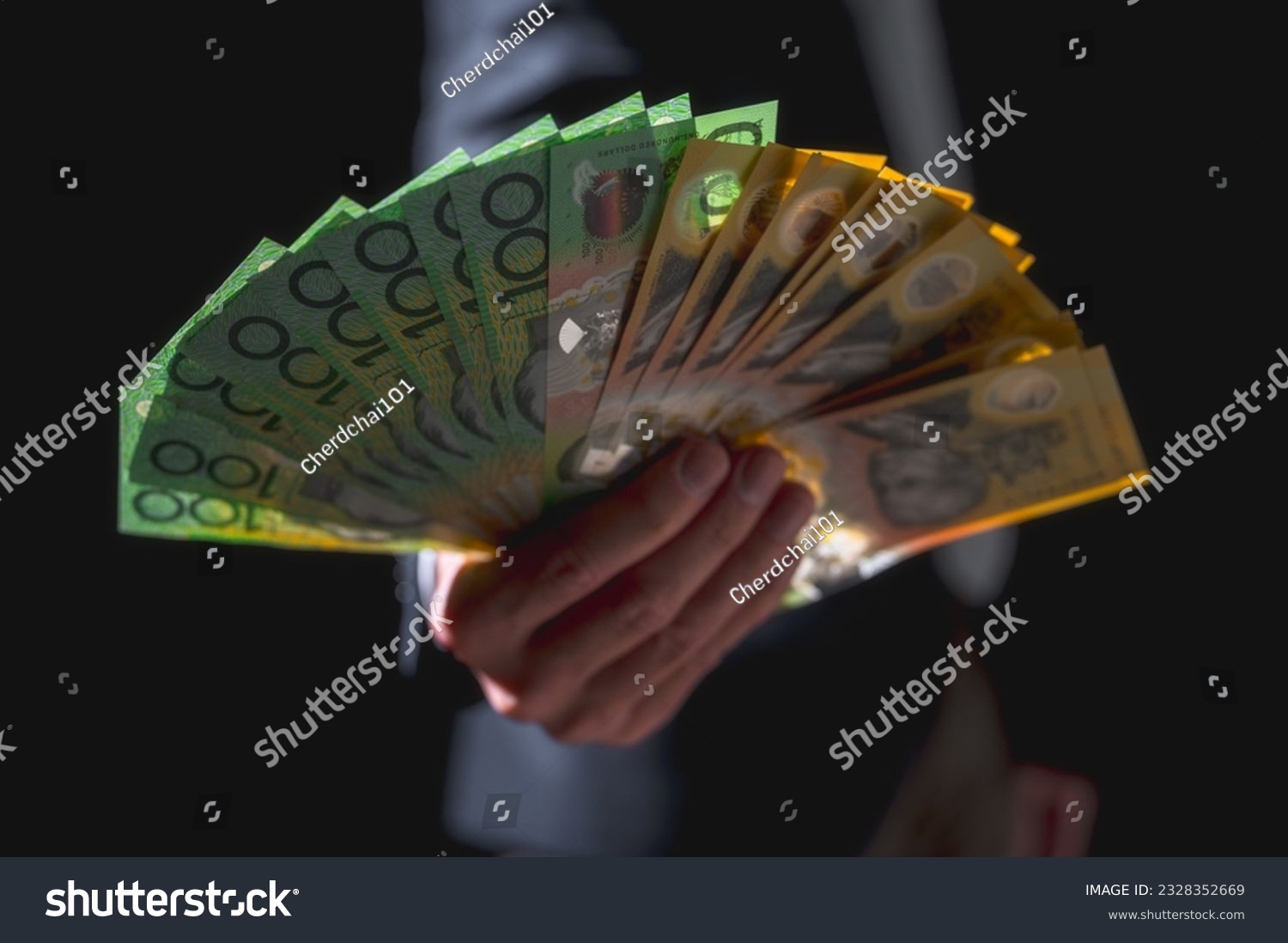 investment and financial saving concept, Money, Australian dollar (AUD) banknotes, in businessman hands, trading property invest stock market investors #2328352669