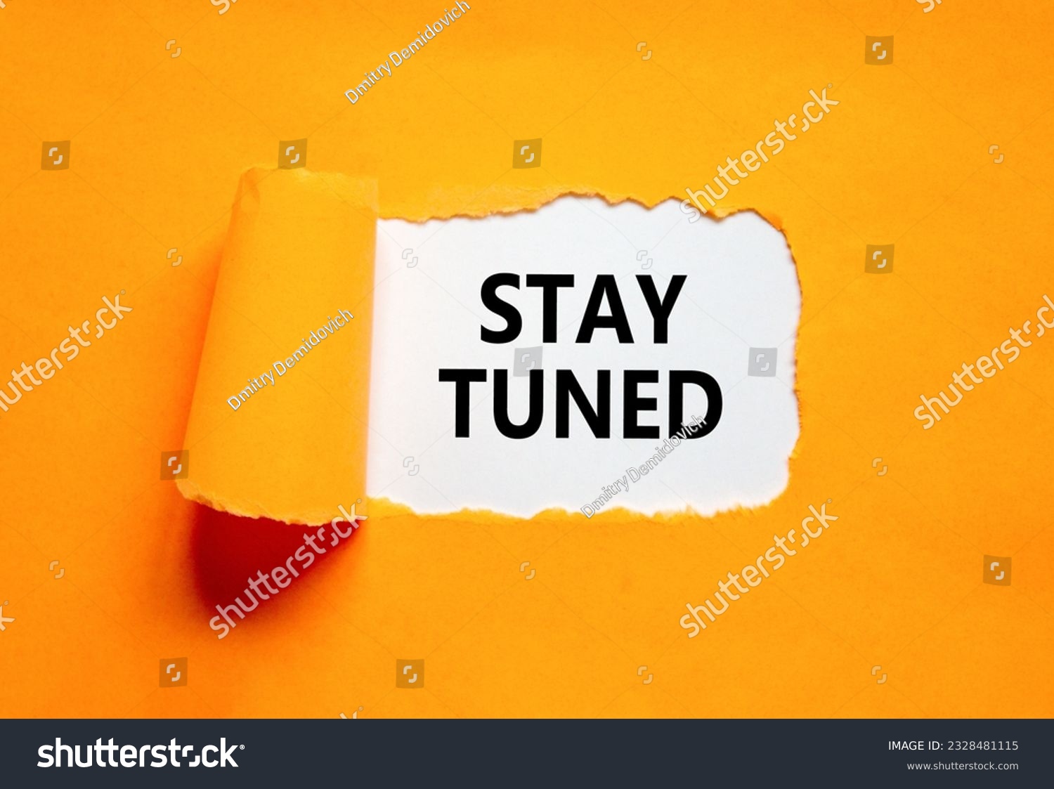 Stay tuned symbol. Concept words Stay tuned on beautiful white paper on a beautiful orange background. Business, support, motivation, psychological and stay tuned concept. Copy space. #2328481115