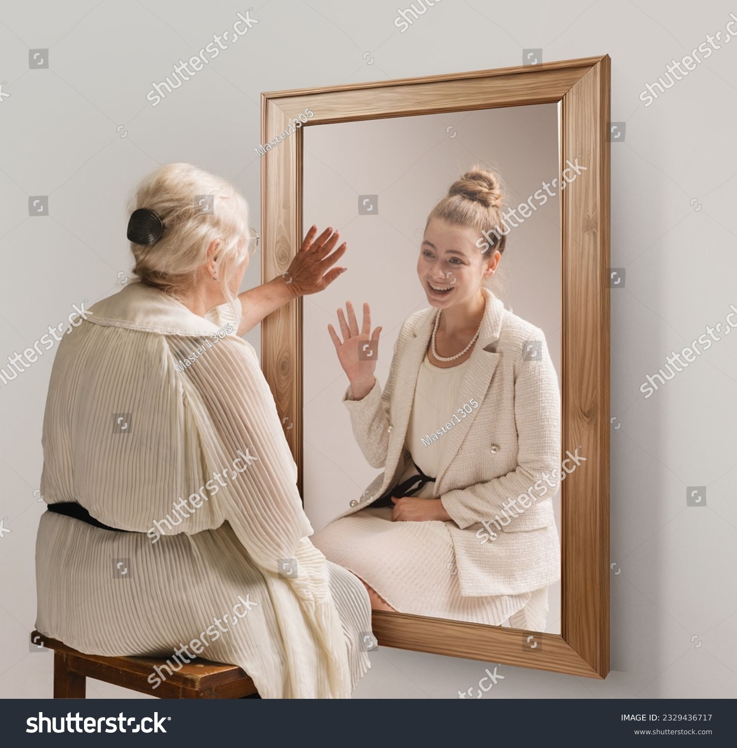 Creative conceptual collage. Tender image of senior woman looking in mirror and smiling to her young self reflection. Back to past. Concept of present, past and future, age, lifestyle, memories, ad #2329436717