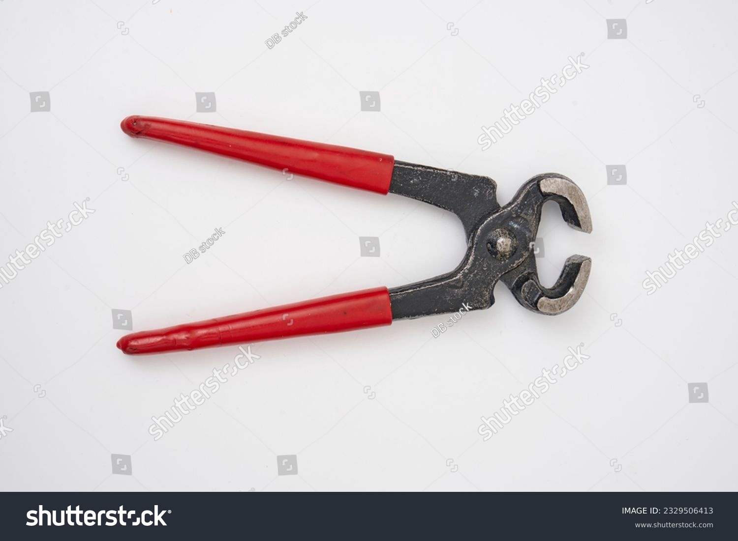 2nd hand pliers with a red plastic handle on a white isolated background                                #2329506413