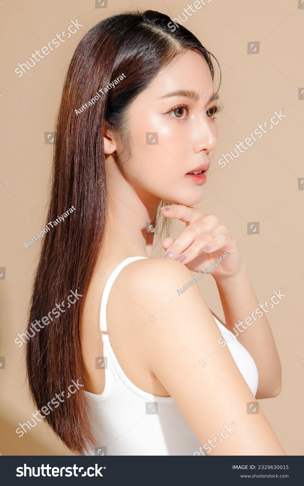Young Asian beauty woman model long hair with korean makeup style on face and perfect skin on isolated beige background. Facial treatment, Cosmetology, Spa, Aesthetic, plastic surgery. #2329630015