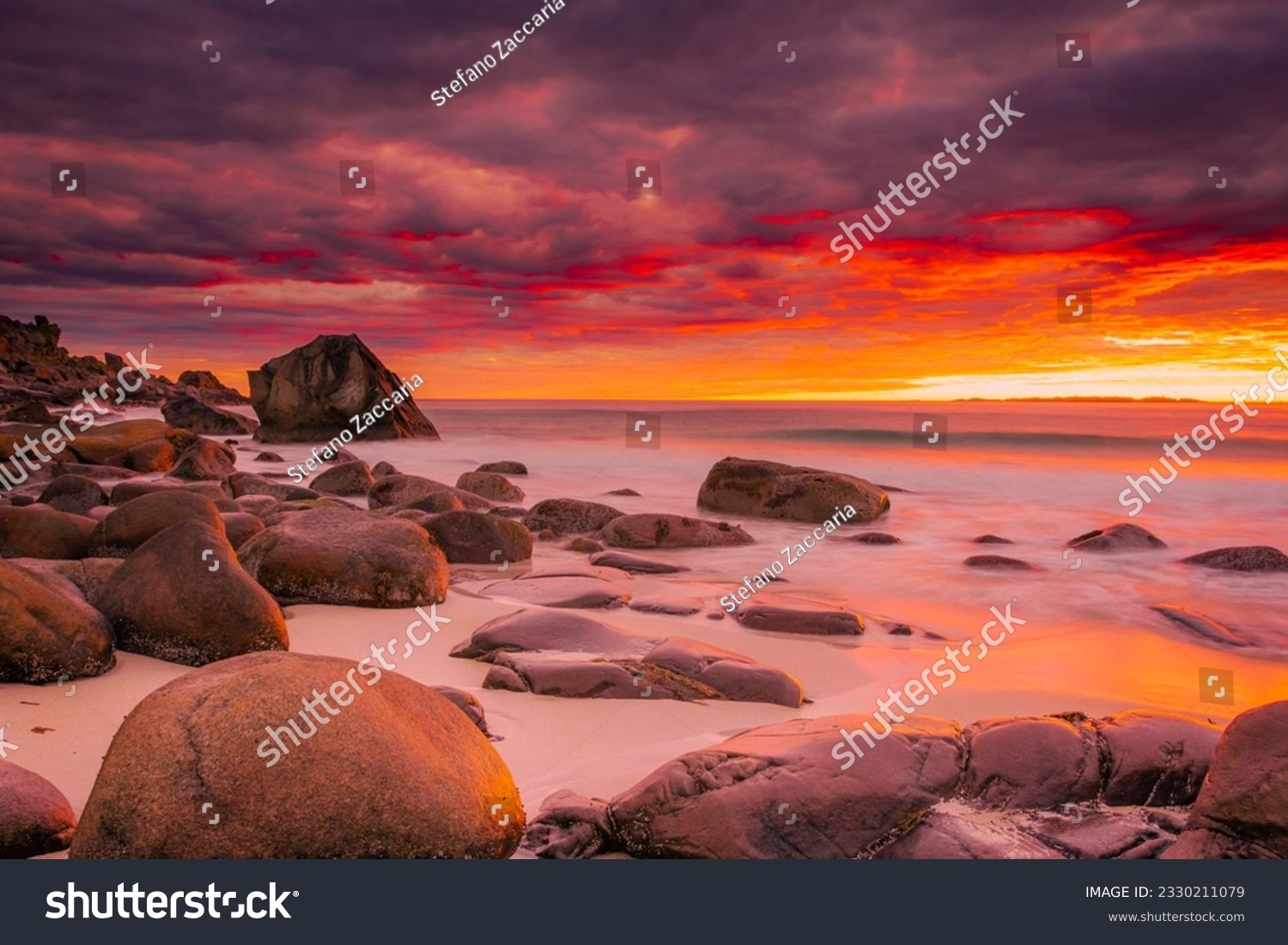 Dramatic midnight sunset with amazing colors over Uttakleiv beach on Lofoten Islands, Norway #2330211079