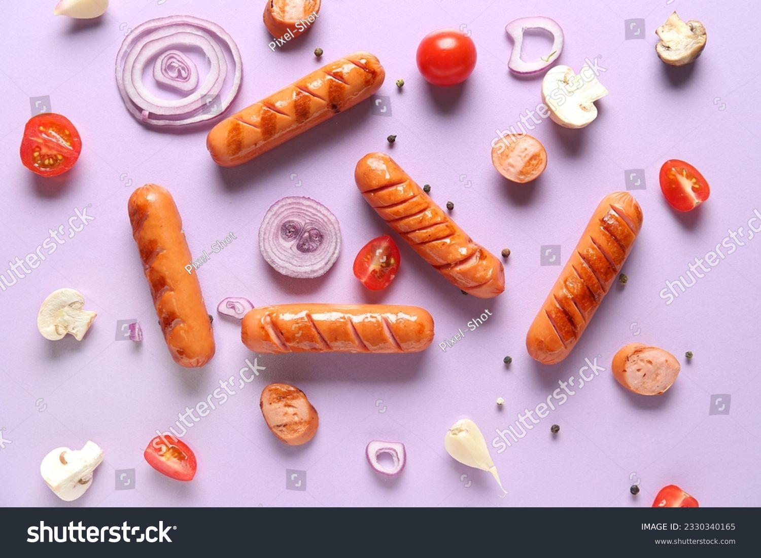 Tasty grilled sausages and vegetables on lilac background #2330340165