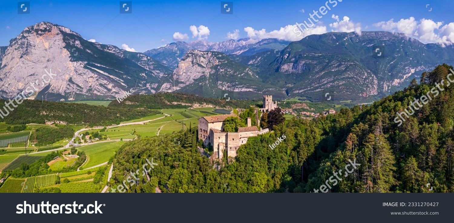 Italy travel destinations. Famous medieval castle Madruzzo in Trentino Alto Adige region province of Trento. Aerial panoramic drone view #2331270427