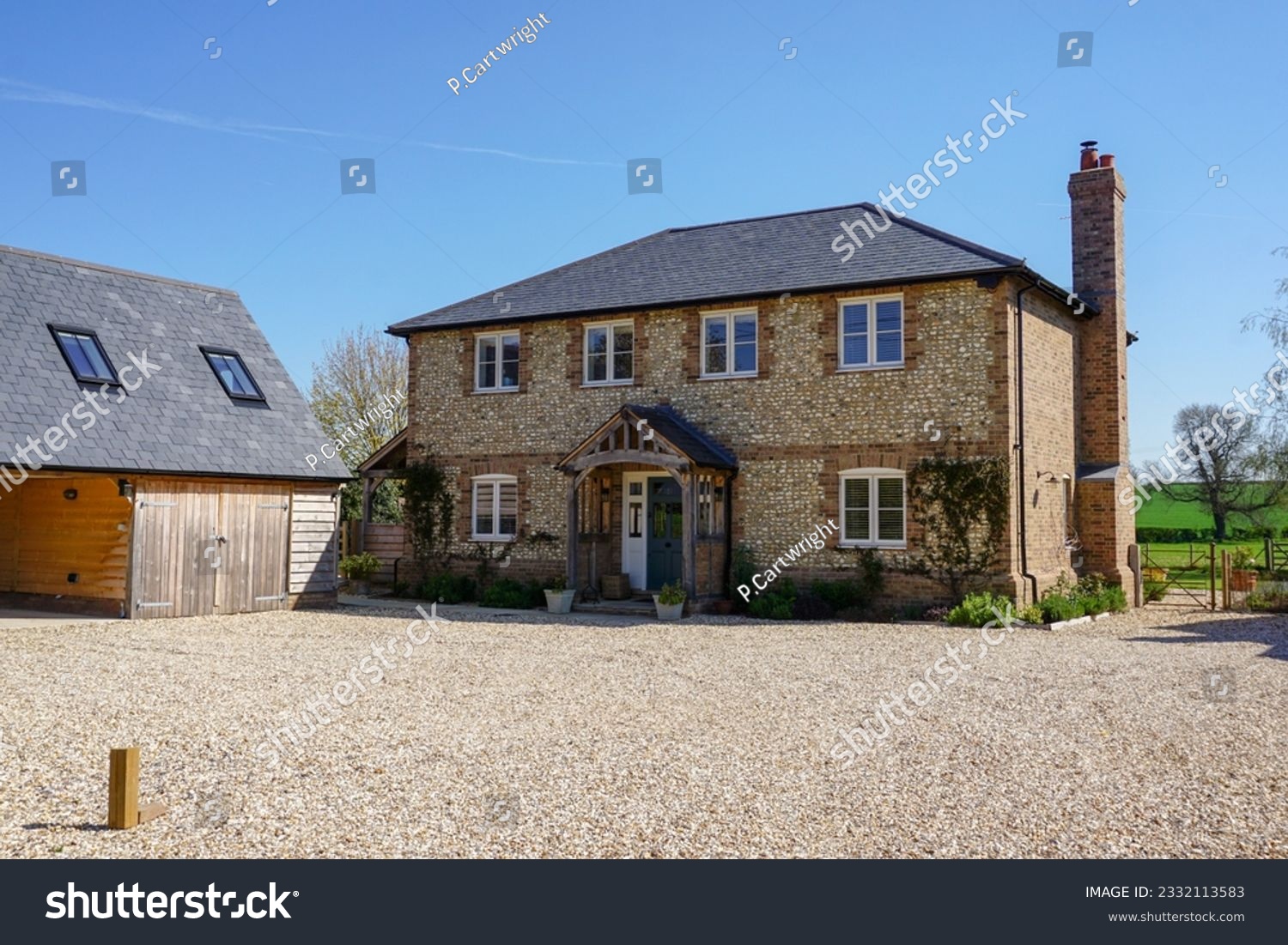 Beautiful house in rural England. Exterior of detached country home  #2332113583
