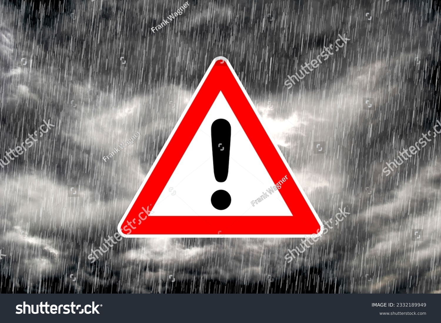 Pictogram of warning triangle with exclamation mark against dramatic under weather sky as symbol for severe weather warning #2332189949