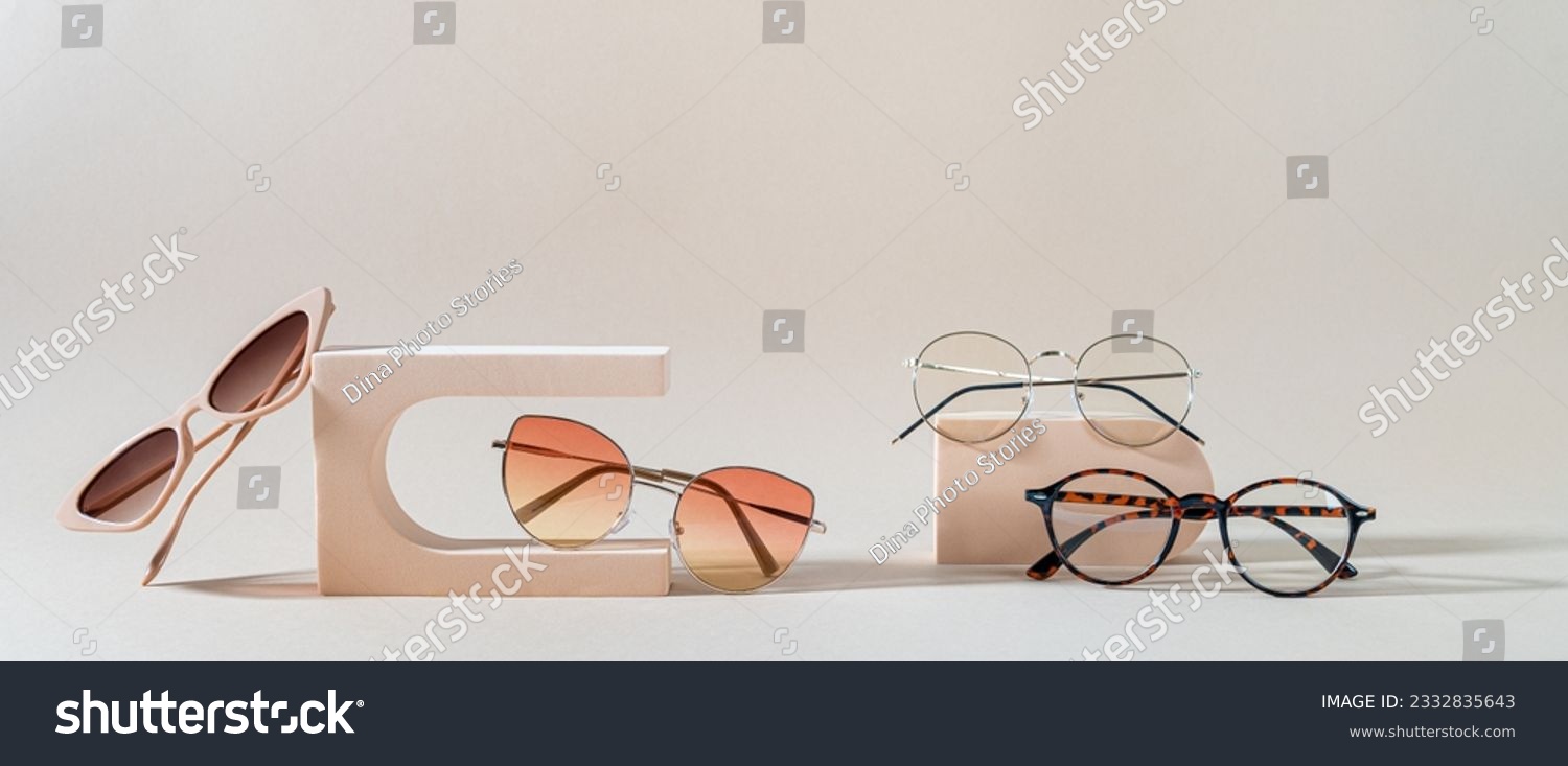 Set of different sunglasses and eyeglasses on podiums on beige background. Summer fashion eyeglasses collection. Sunglasses sale, discount, promotion banner. Minimal style flat lay, copy space #2332835643