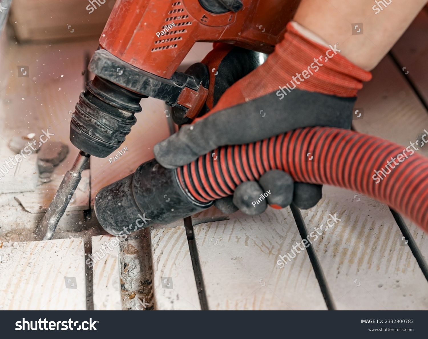 Construction worker use vacuum cleaning concrete floor for Install underfloor heating electrical cable. #2332900783