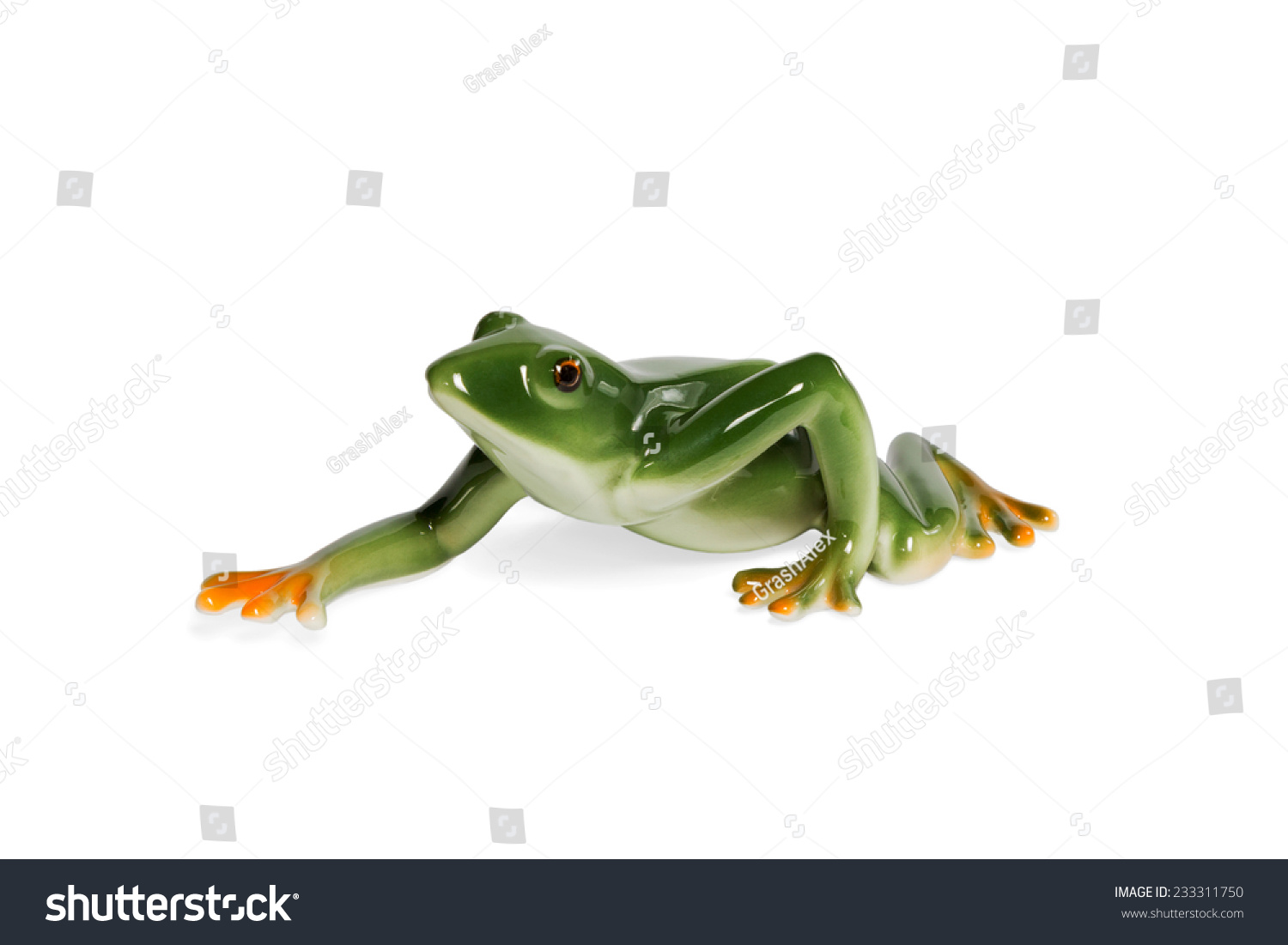 Glass figurine green frog crawling side view isolated on white background #233311750