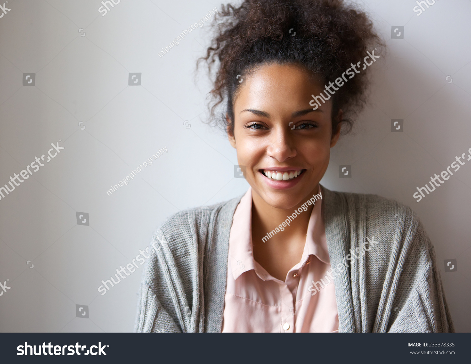 Close up portrait of a beautiful young african american woman smiling #233378335