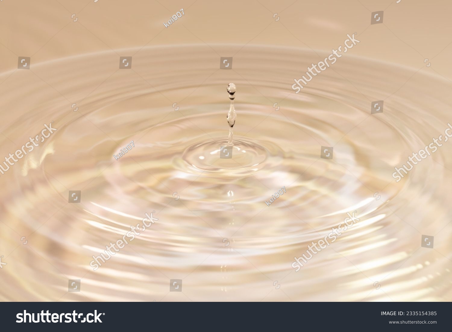 Water drops falling on water surface #2335154385
