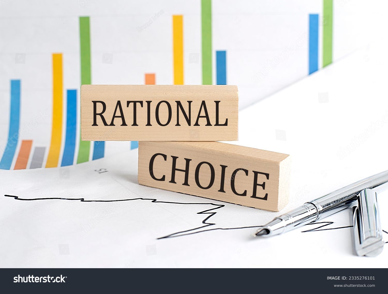 RATIONAL CHOICE text on wooden block on chart background, business concept #2335276101