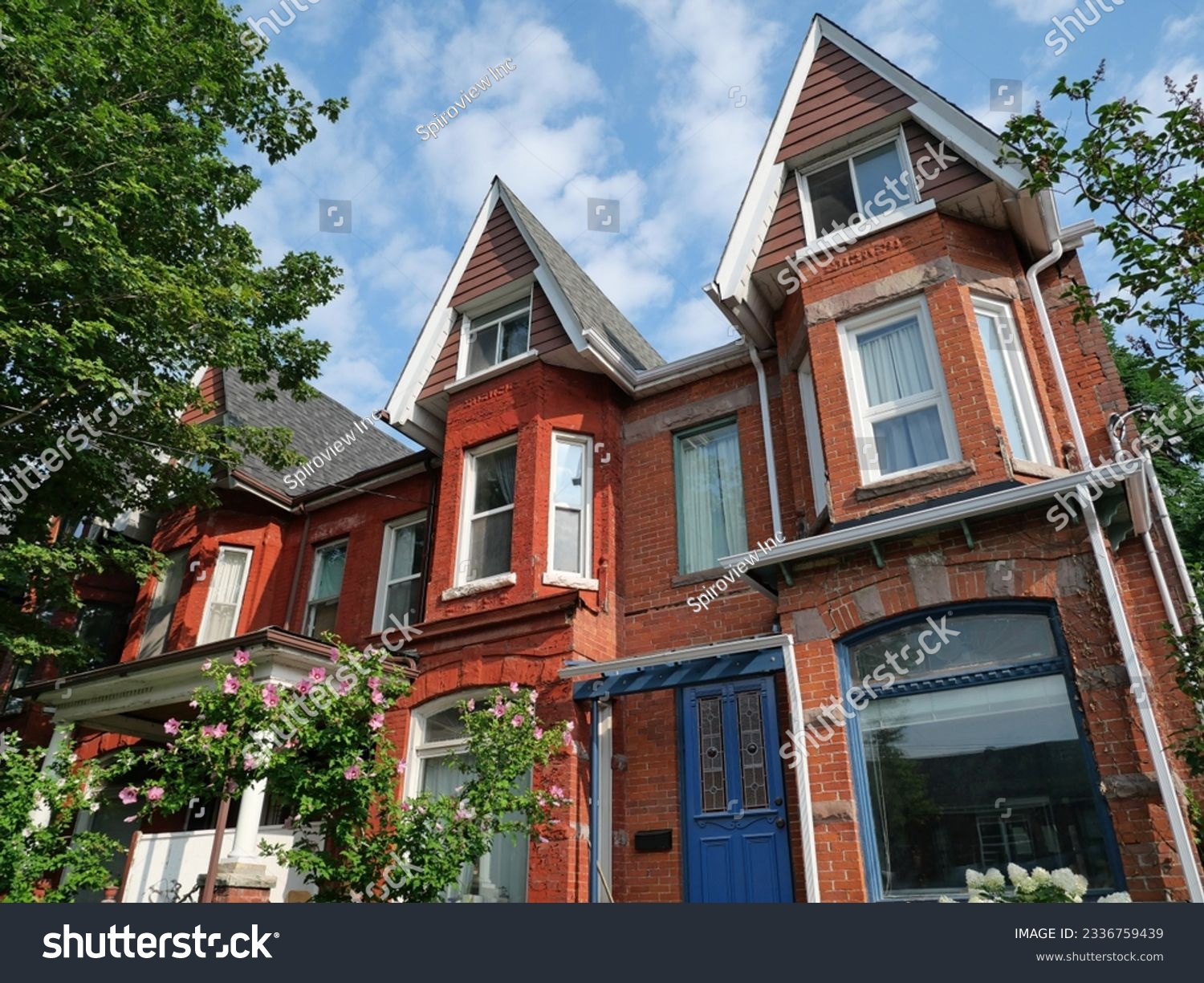 Old Victorian style narrow row houses with gables #2336759439