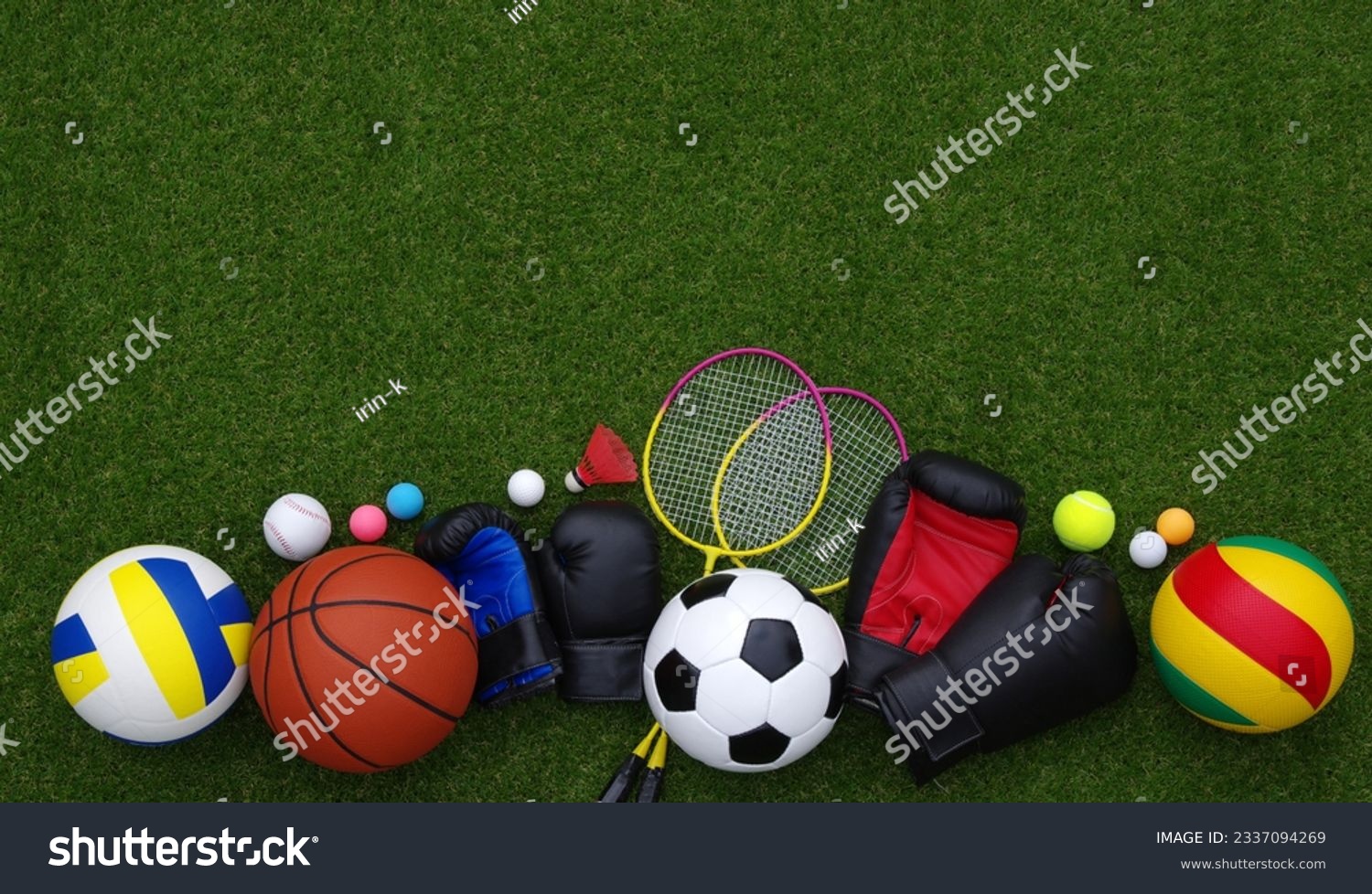Set of sport equipment on green grass #2337094269