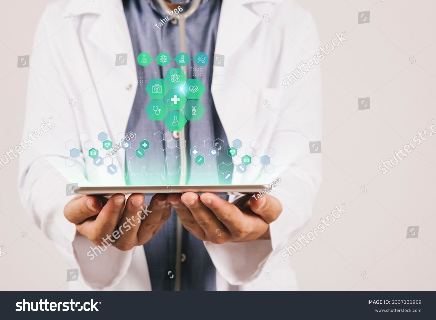 Doctor's Tech Toolkit: Handheld Device Displaying a Set of Technology Icons #2337131909