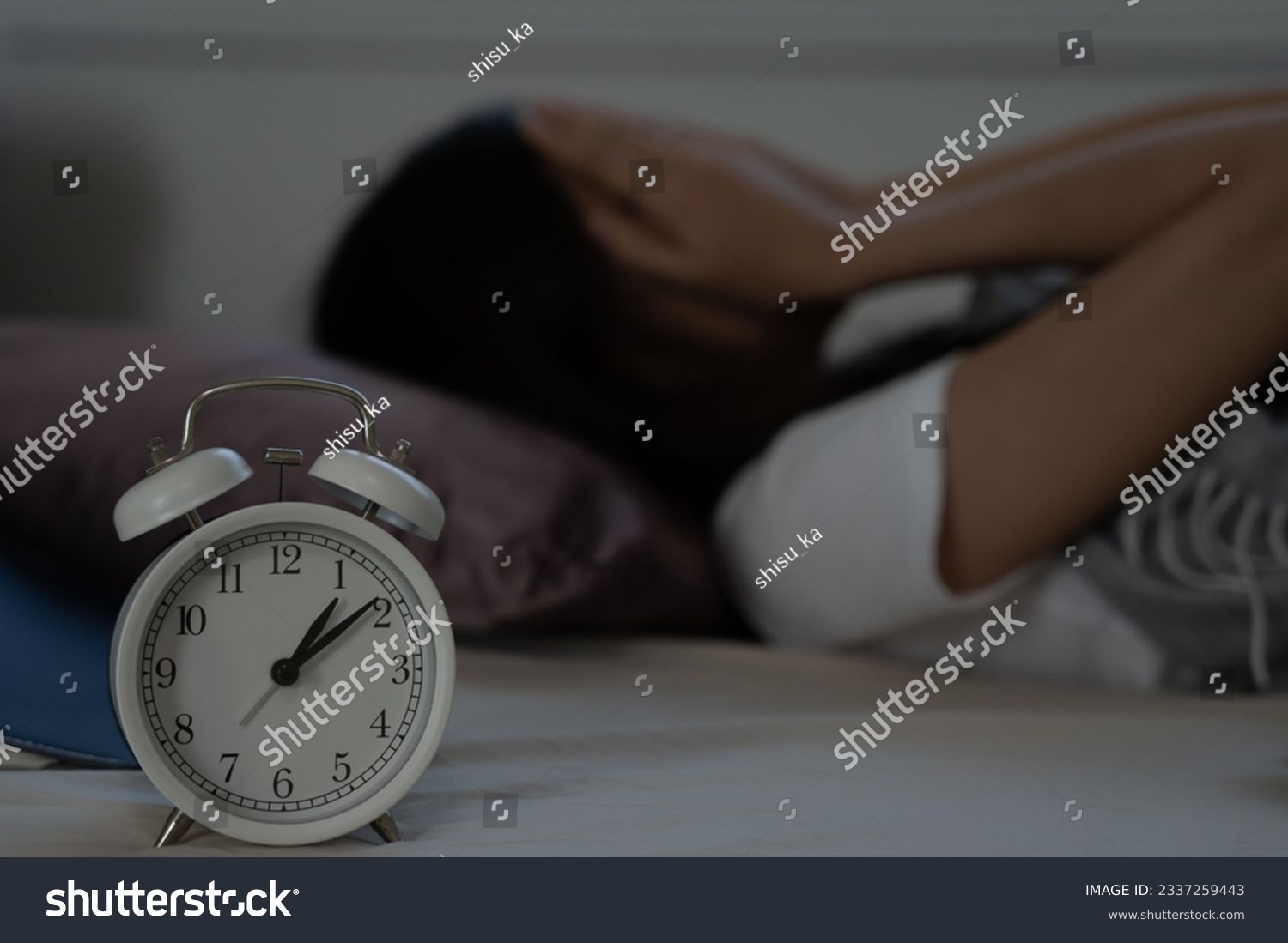 asian woman in bed late trying to sleep suffering insomnia, sleepless or scared in a nightmare, looking sad worried and stressed. Tired and headache or migraine waking up in the middle of the night. #2337259443
