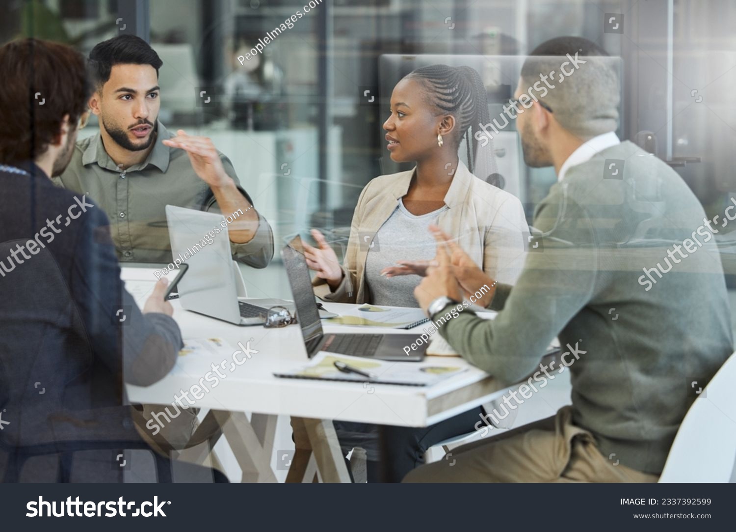 Meeting, collaboration and business people in discussion in the office while working together. Teamwork, planning and group of employees brainstorming with technology for a project in the workplace. #2337392599