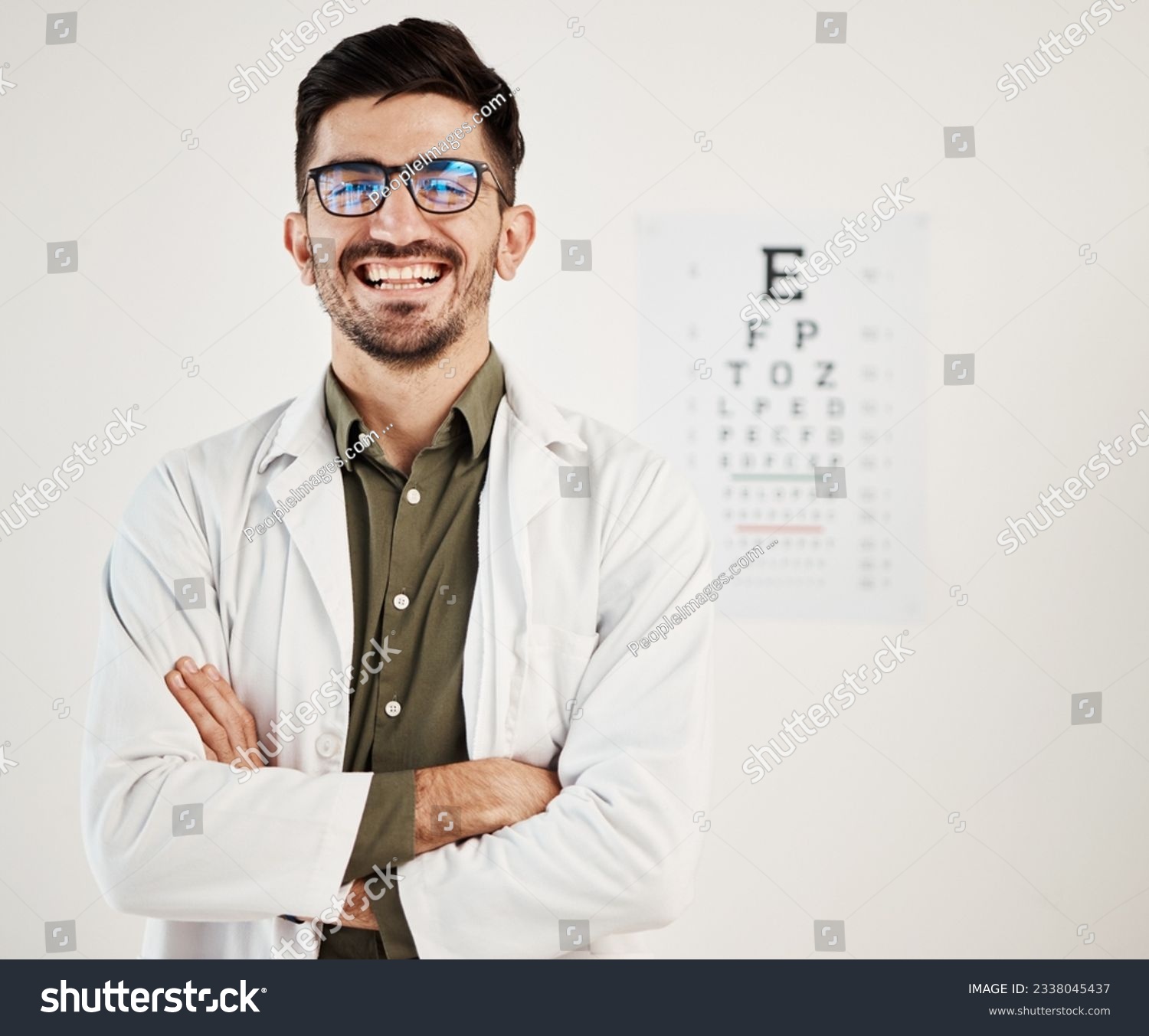Eye exam, arms crossed and portrait of man optometrist with smile, confidence and friendly service in consultation office. Ophthalmology, face and happy male eye expert proud of vision testing career #2338045437
