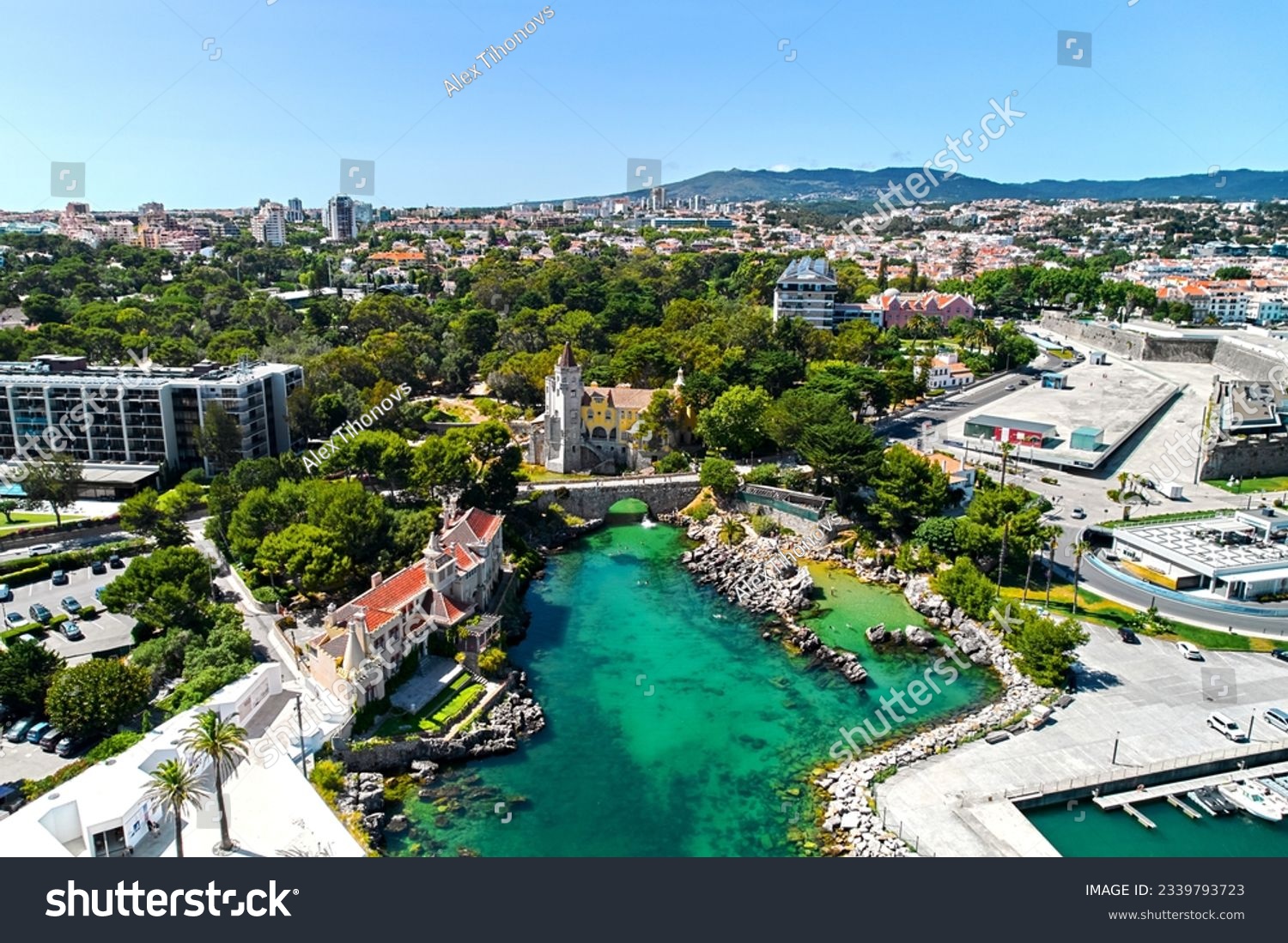 Cascais coastal resort town in Lisbon at sunny summer day, drone point of view of townscape. Turquoise waters of the Atlantic Ocean, rocky coastline. Travel, tourism concept. Portugal #2339793723