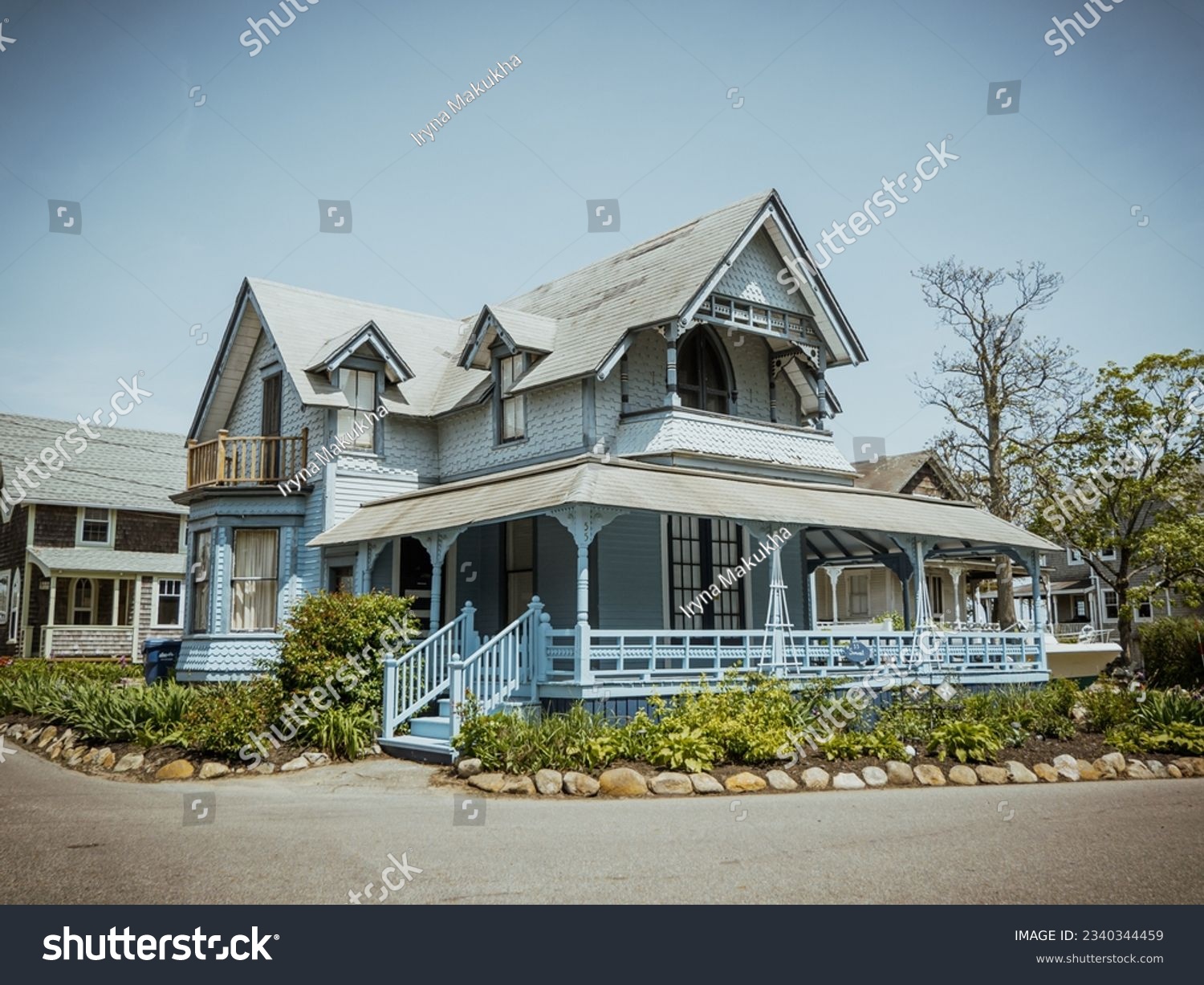 Beautiful colourful gingerbread houses, cottages in Oak Bluffs center, Martha's Vineyard island in Massachusetts USA on a sunny summer day #2340344459