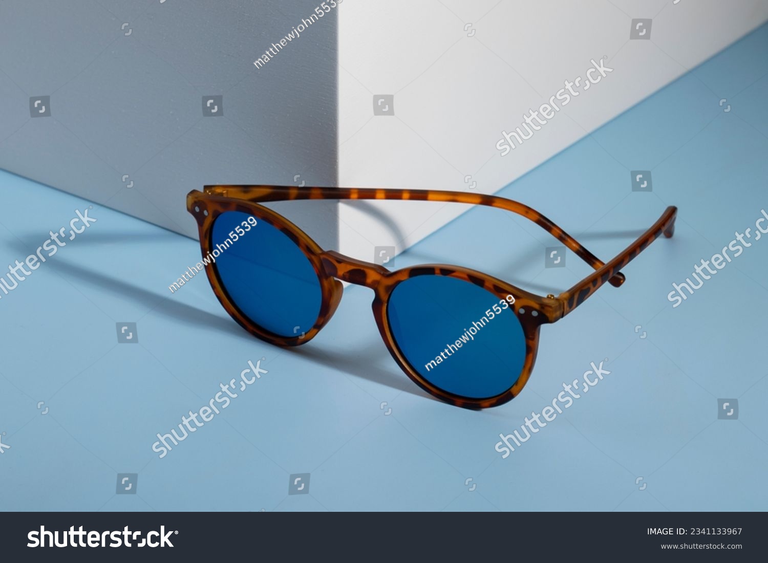 Sunglasses and glasses sale concept. Trendy sunglasses background. Trendy Fashion summer accessories. Copy space for text. Summer sale. Optic store discount poster. glasses with rounded frames. #2341133967