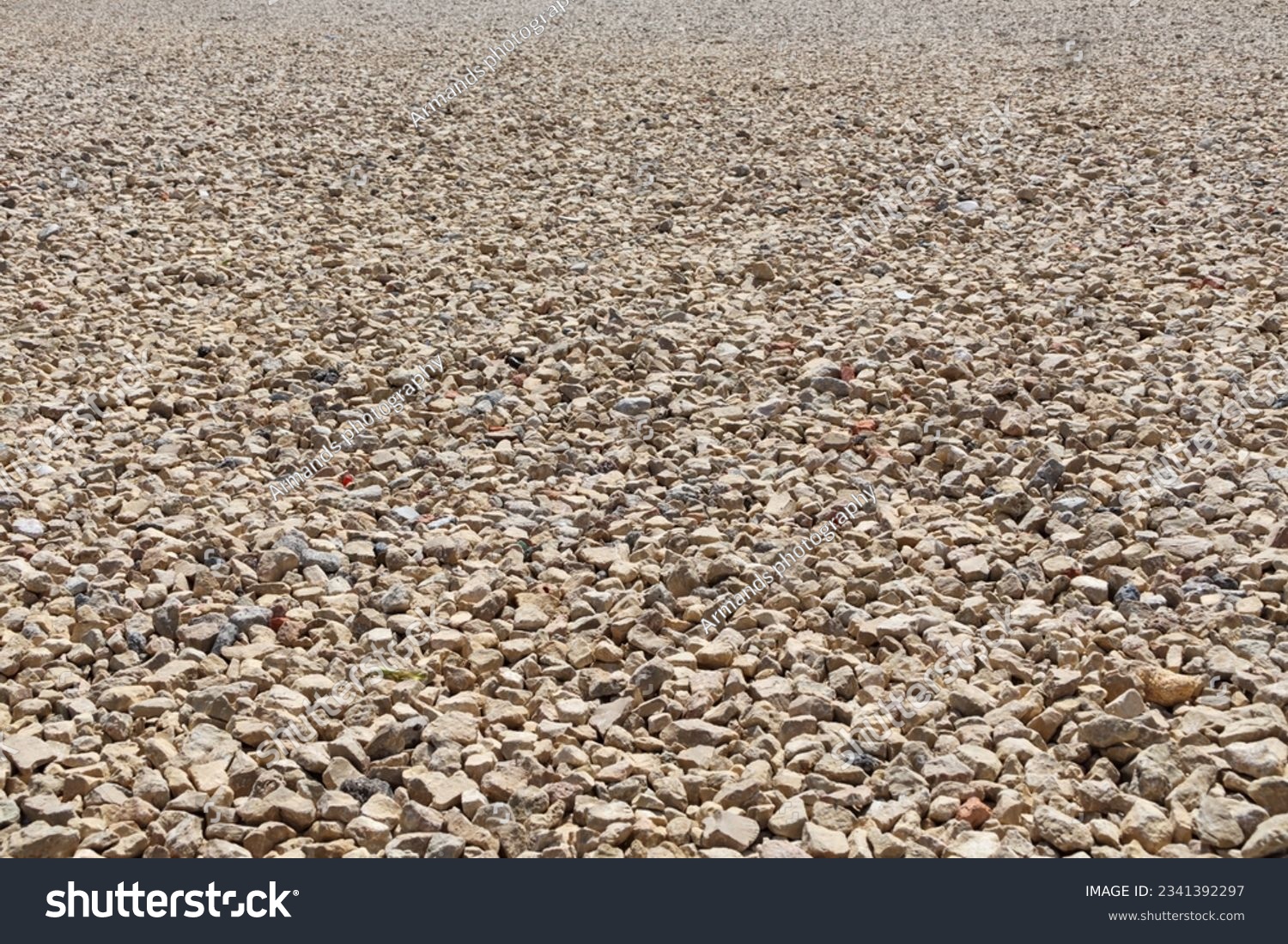 Background of crushed stones in perspective. Granite stones, small stone chips, building material rock, gravel texture. #2341392297