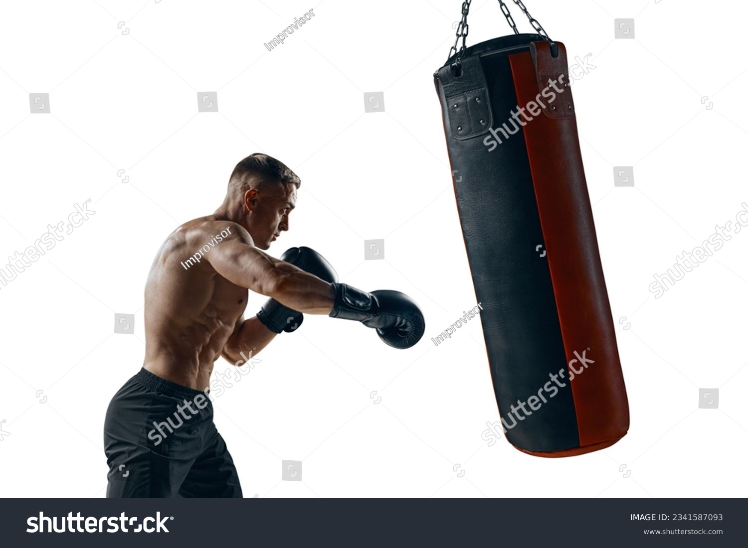 Silhouette of a strong male boxer punching boxing bag. #2341587093