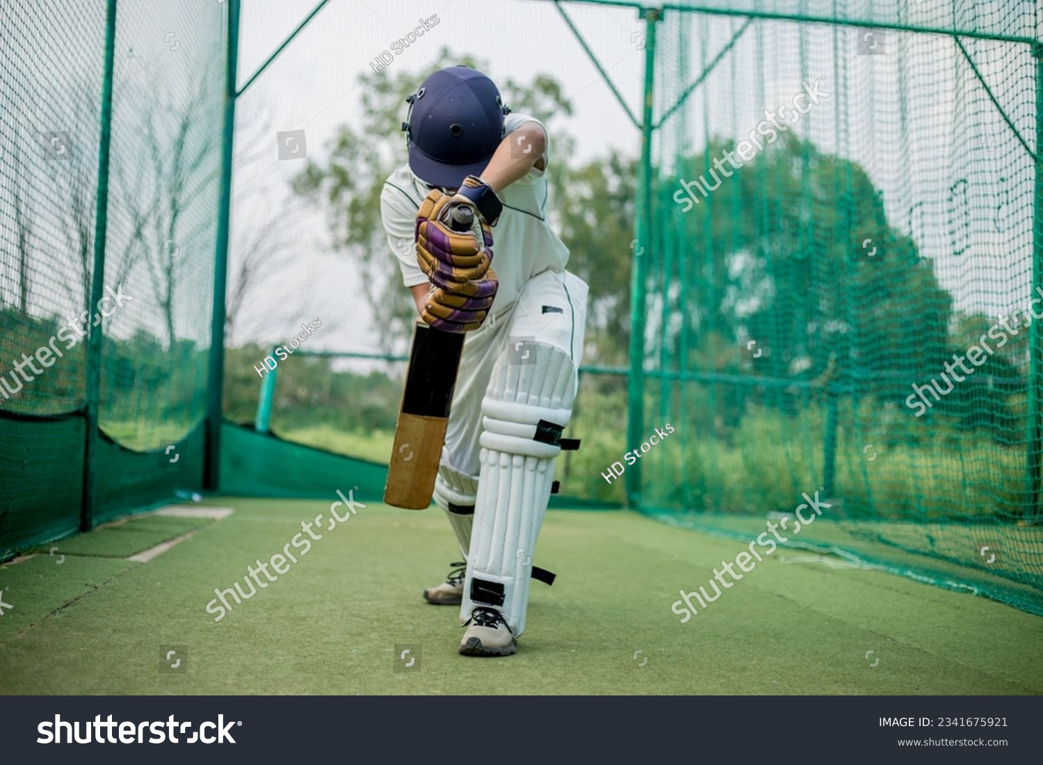 Front view of Cricket Batsman Action, Cricket game closeup player batting ball  #2341675921
