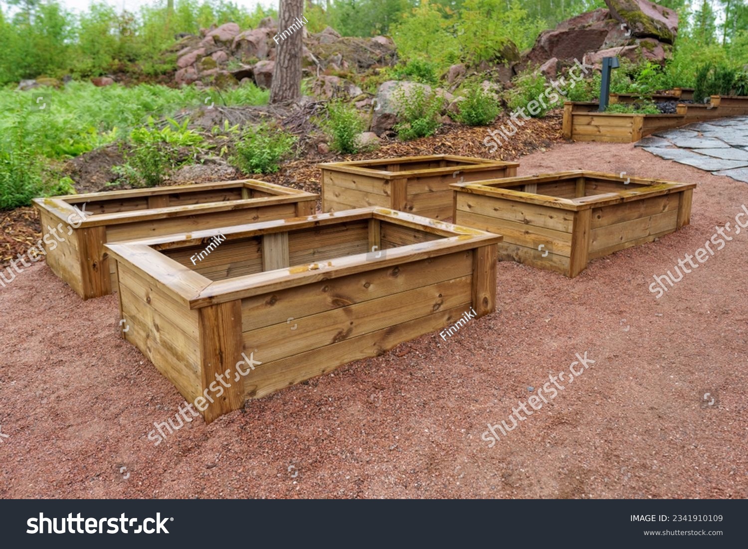 Empty wooden planter boxes ready to be used. With a planter box, you can easily produce vegetables for your own needs. #2341910109