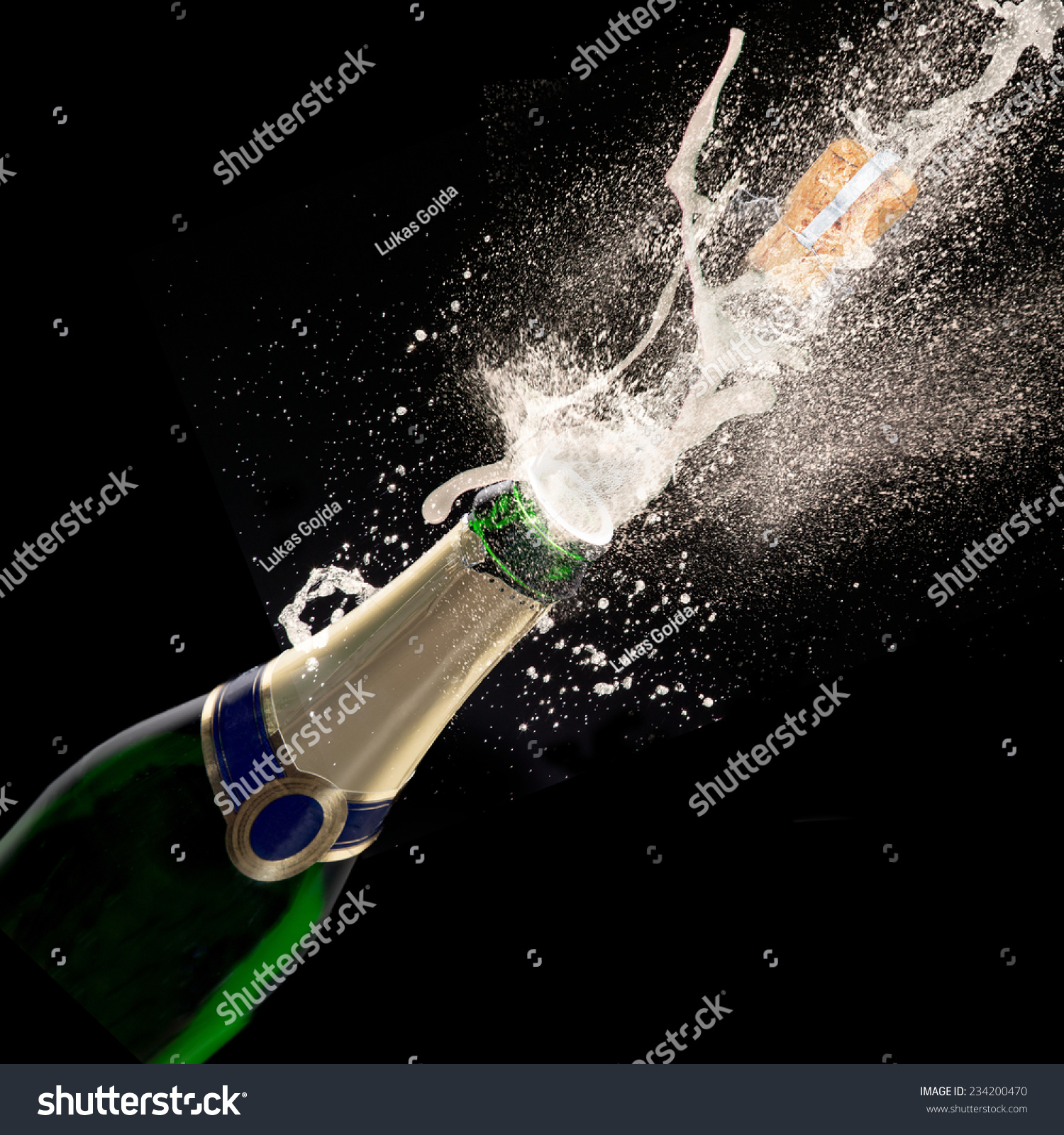 Champagne explosion on black background, celebration theme. #234200470