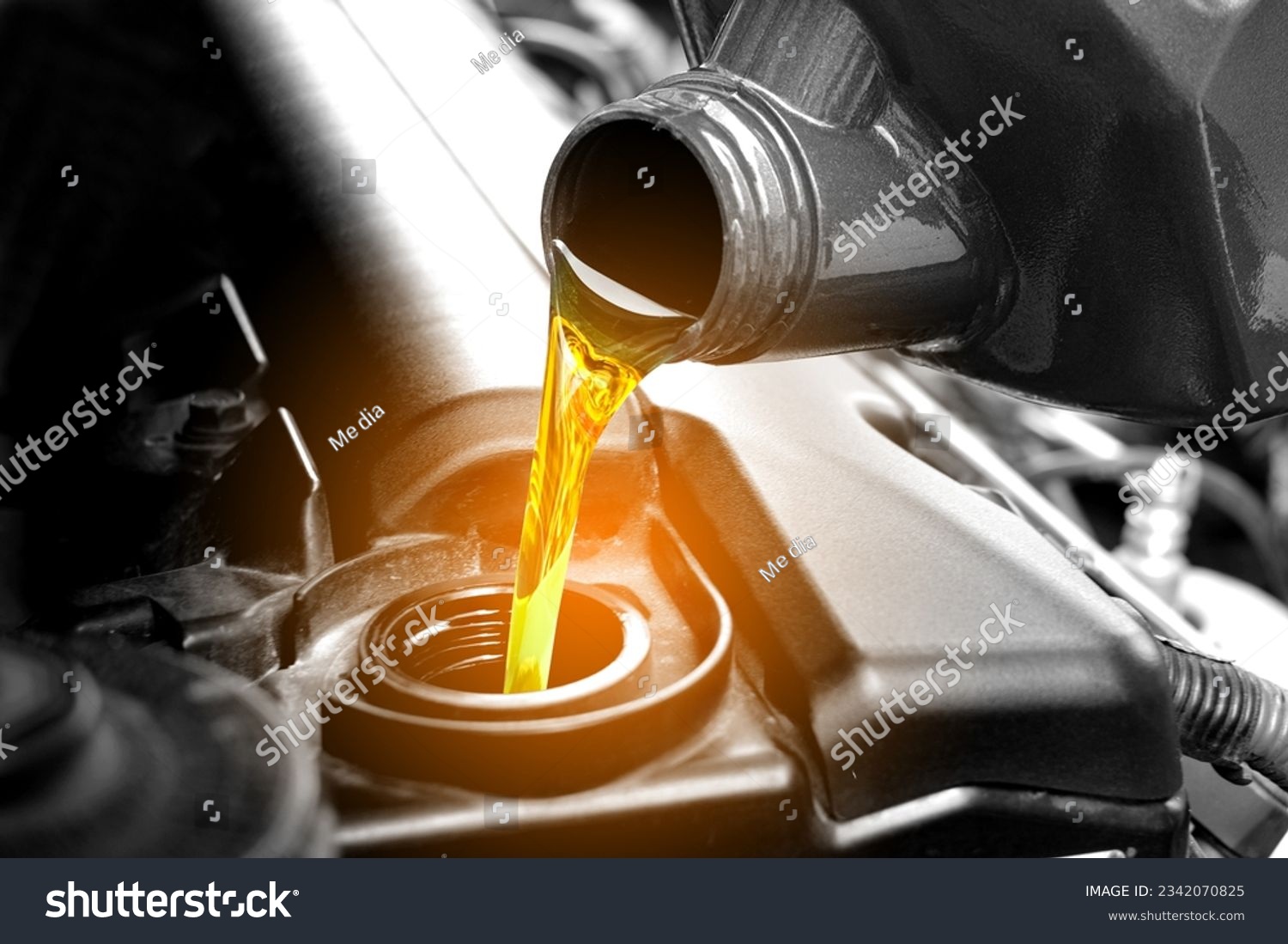 Refueling and pouring oil quality into the engine motor car Transmission and Maintenance Gear .Energy fuel concept. #2342070825