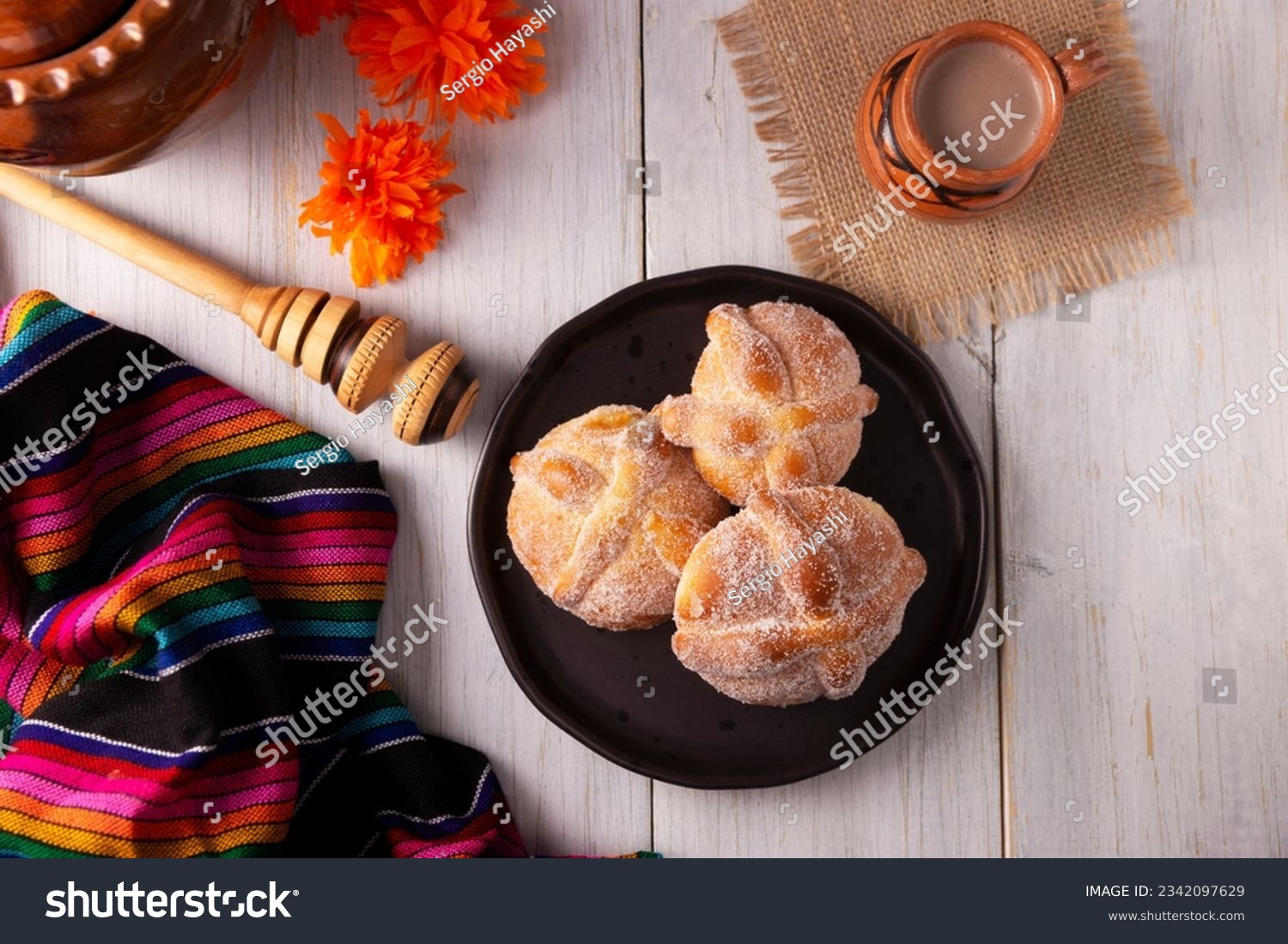Pan de Muerto. Typical Mexican sweet bread that is consumed in the season of the day of the dead. It is a main element in the altars and offerings in the festivity of the day of the dead. #2342097629
