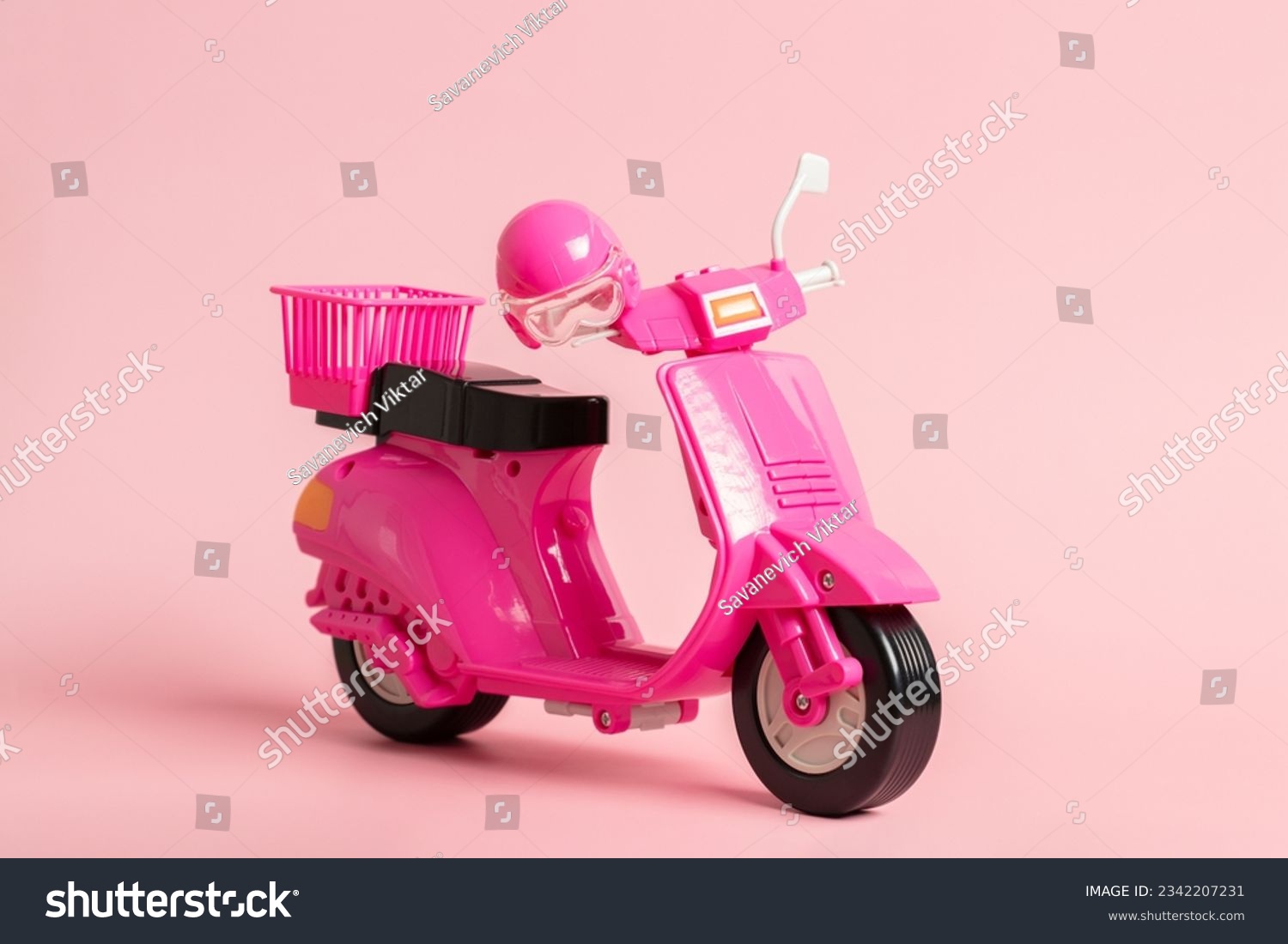 Pink vintage toy doll scooter or motorbike with helmet on pastel pink background. 80s, clsssic, retro style #2342207231