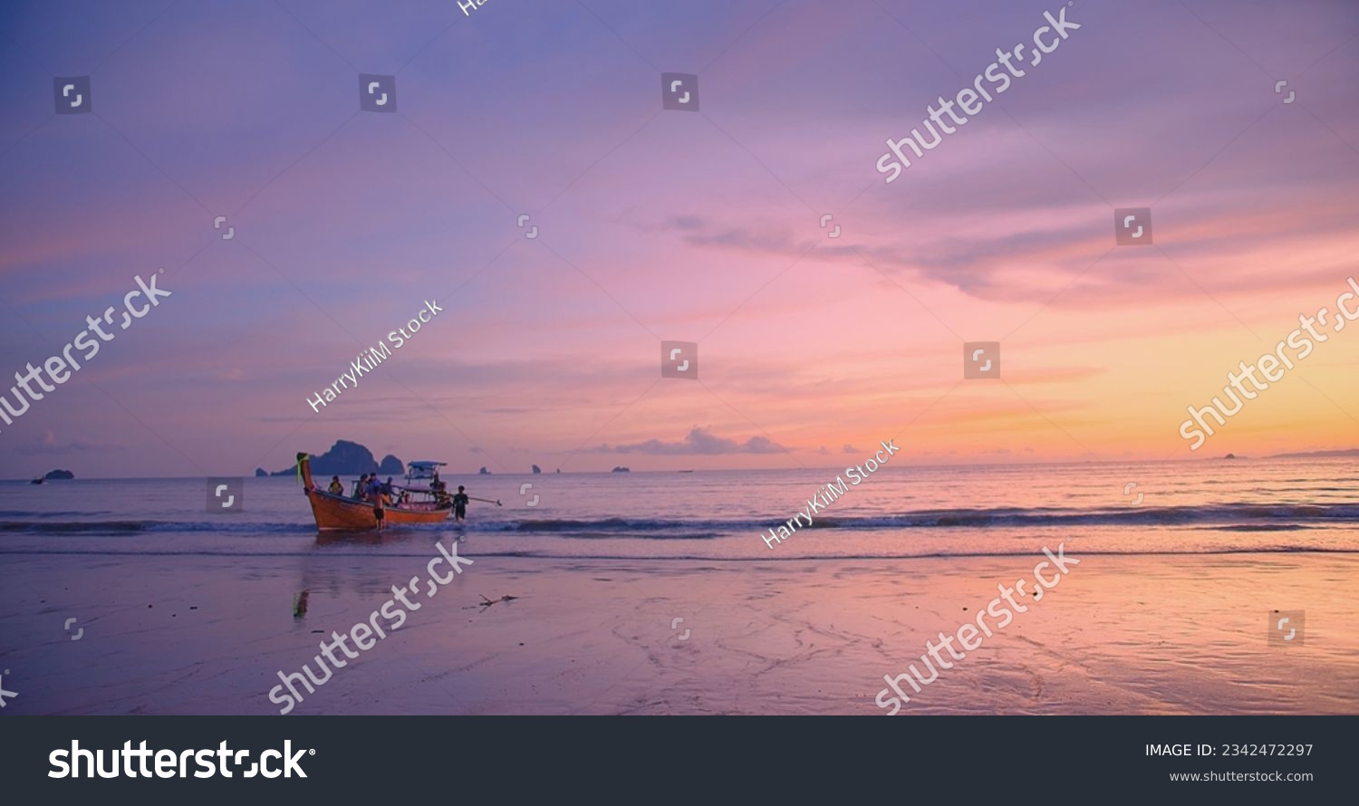 Beautiful amazing sunset over tropical ocean Andaman sea beach with colorful sky and Long tail boats in summer at Ao Nang, Krabi, Thailand, tourism vacation holiday travel trip destination concept #2342472297