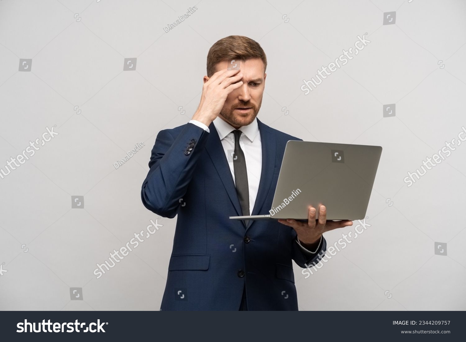 Frustrated businessman with laptop in hands. Worried trader man failed on stock exchange failed in trading, falling sales, business collapse, difficulties financial problems, burnt investments #2344209757