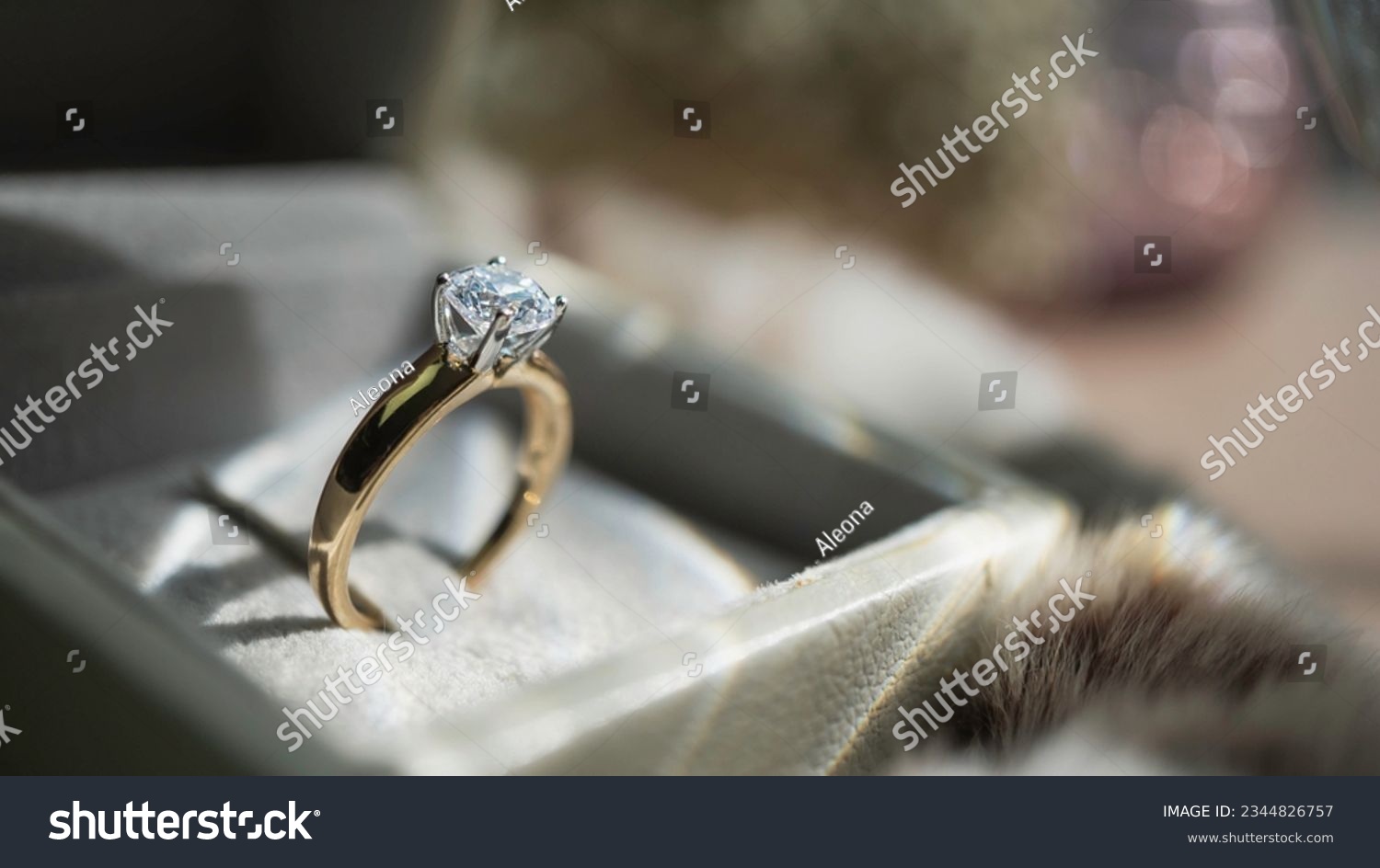 Close up of diamond ring with sunlight and shadow background. Love, valentine, relationship and wedding concept. Soft and selective focus. #2344826757