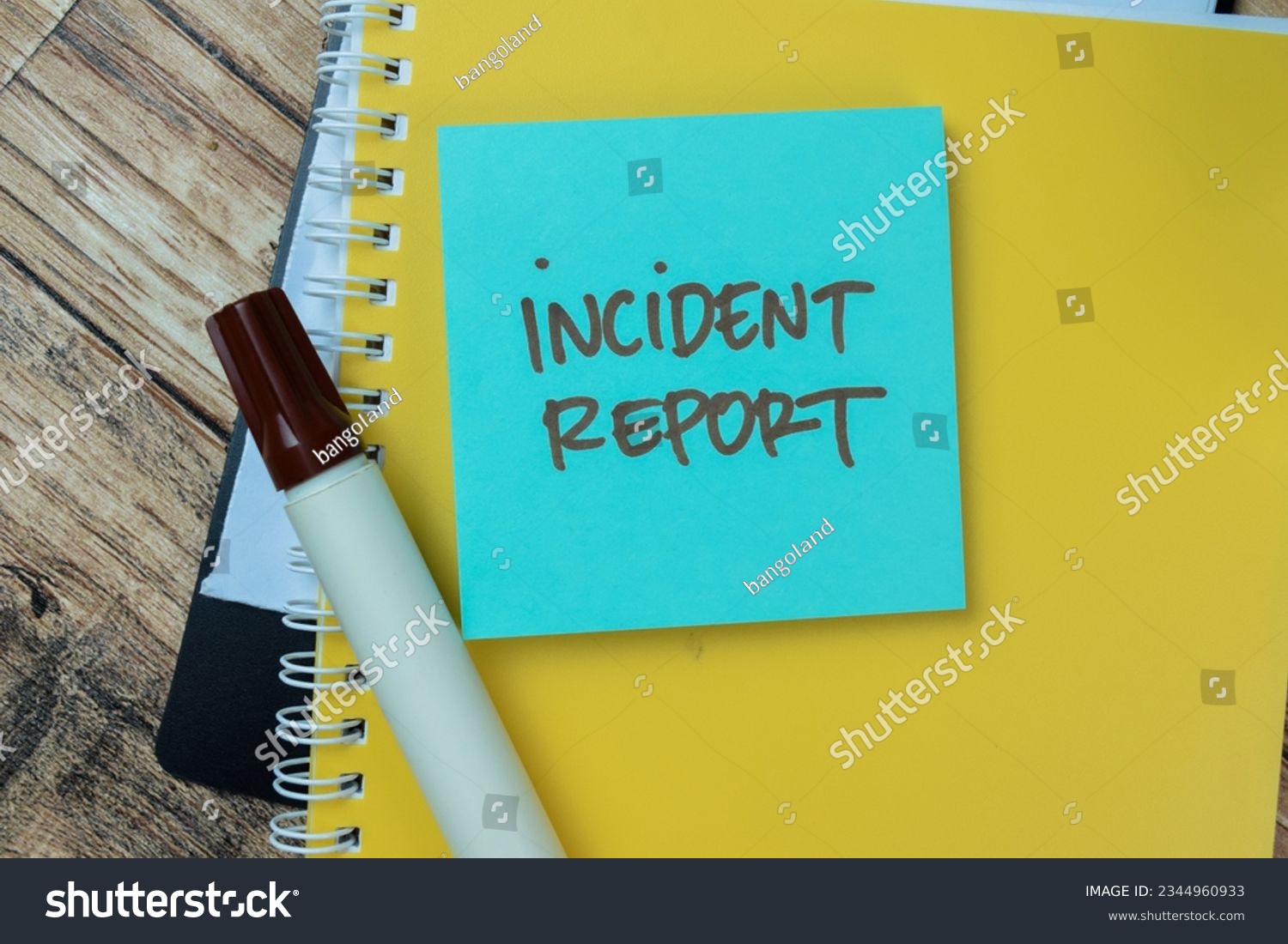 Concept of Incident Report write on sticky notes isolated on Wooden Table. #2344960933