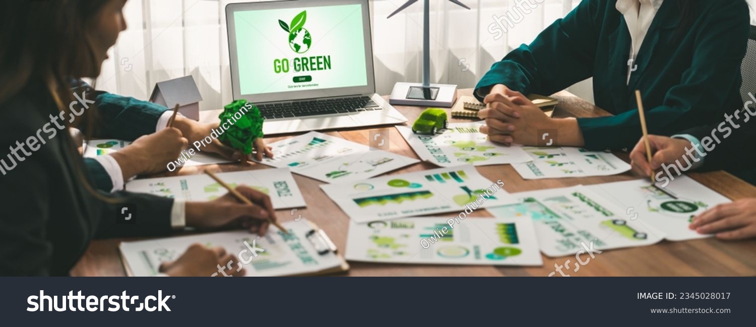 Go green ecology awareness campaign display on laptop on eco-friendly company meeting with business people implementing environmental protection for clean and sustainable future ecology. Trailblazing #2345028017