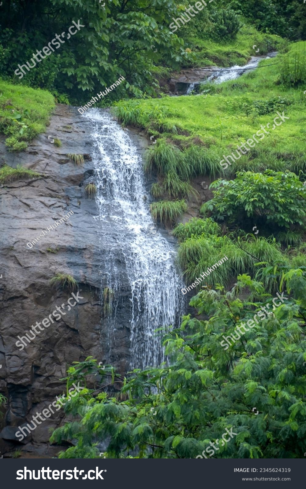 Aerial footage of a monsoon season waterfall near Pune India. Monsoon is the annual rainy season in India from June to September. #2345624319