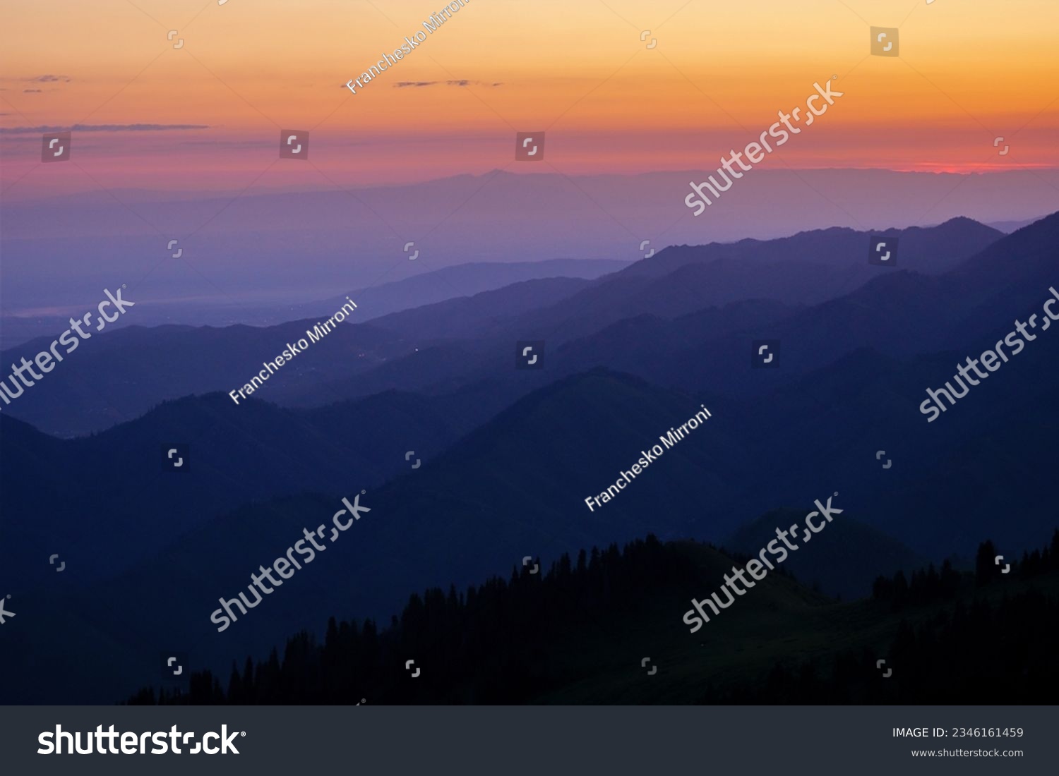 Silhouettes of mountain ranges in the morning haze. Blue hour                                #2346161459