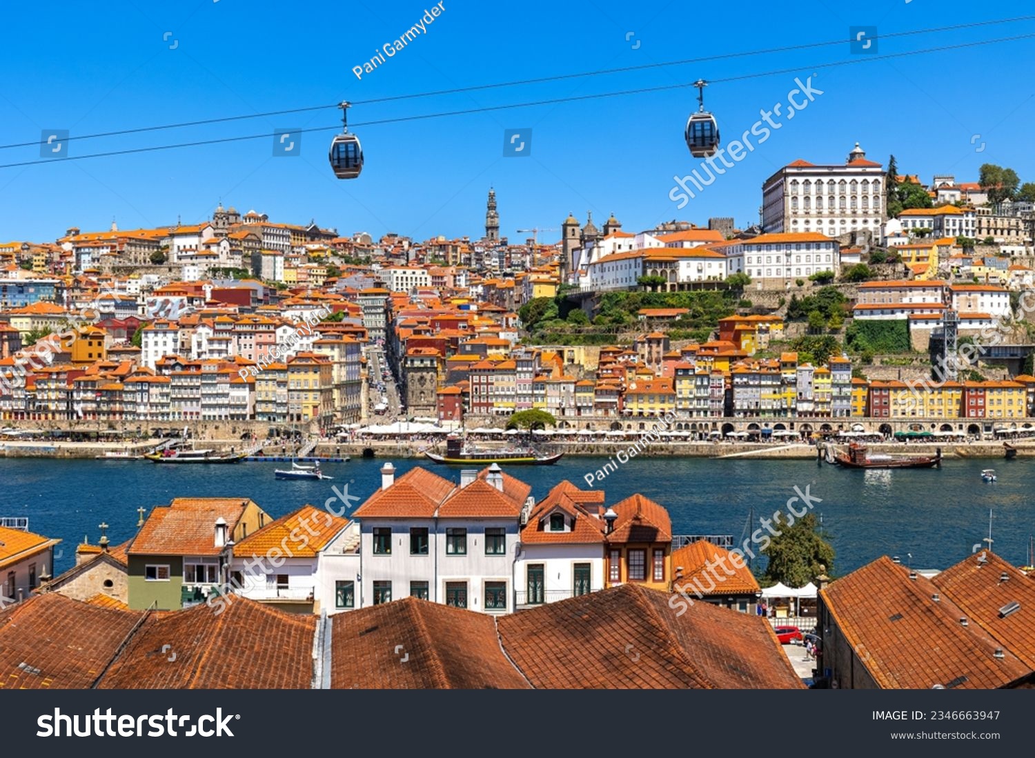 Aerial panorama of Porto with steep cable railway and the medieval Ribeira (riverside) district, narrow cobbled streets wind past merchants’ houses and cafes #2346663947